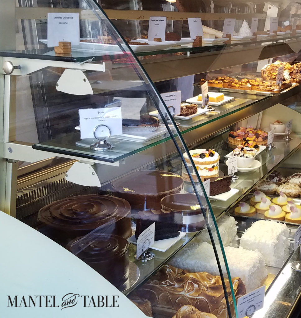The dessert case at Tartine Bakery! Beautiful pastries on glass shelves.