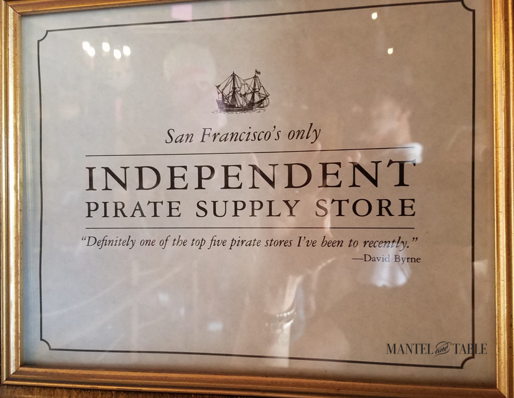 Pirate Supply Store sigh in gold frame.