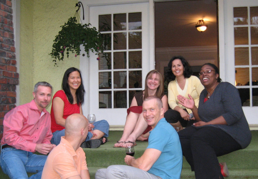Summer partiers sitting on the front porch
