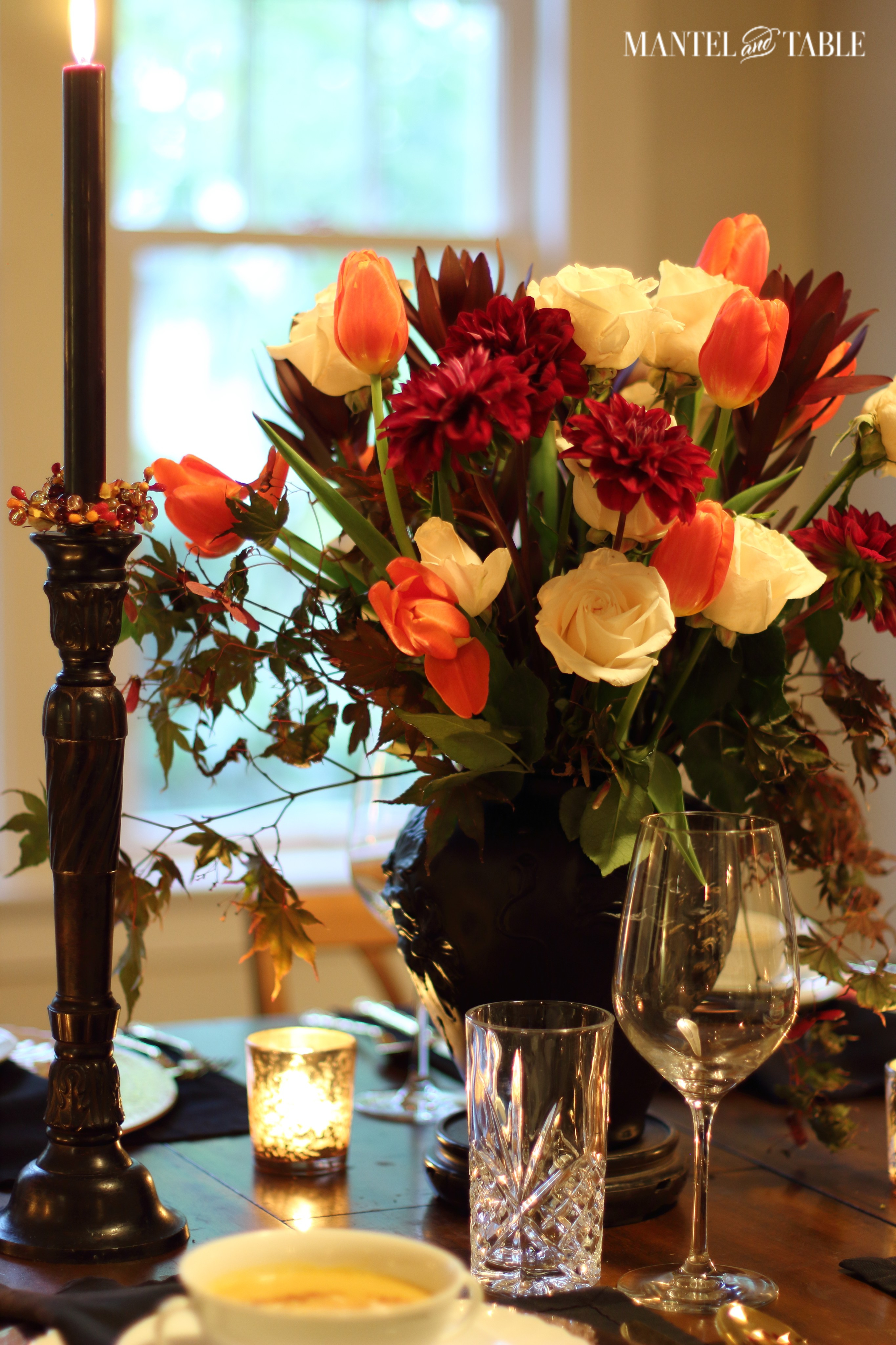 Cut crystal highball/water glass & large wine glass. Flower arrangement in background