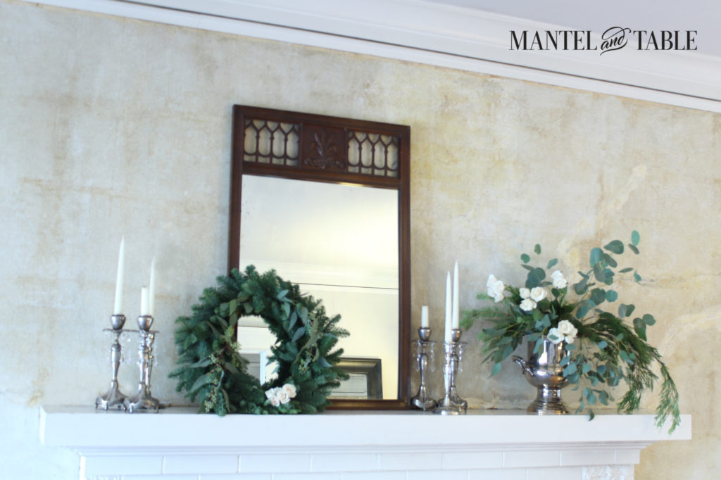 White Mantel with matching white flowers & wreath