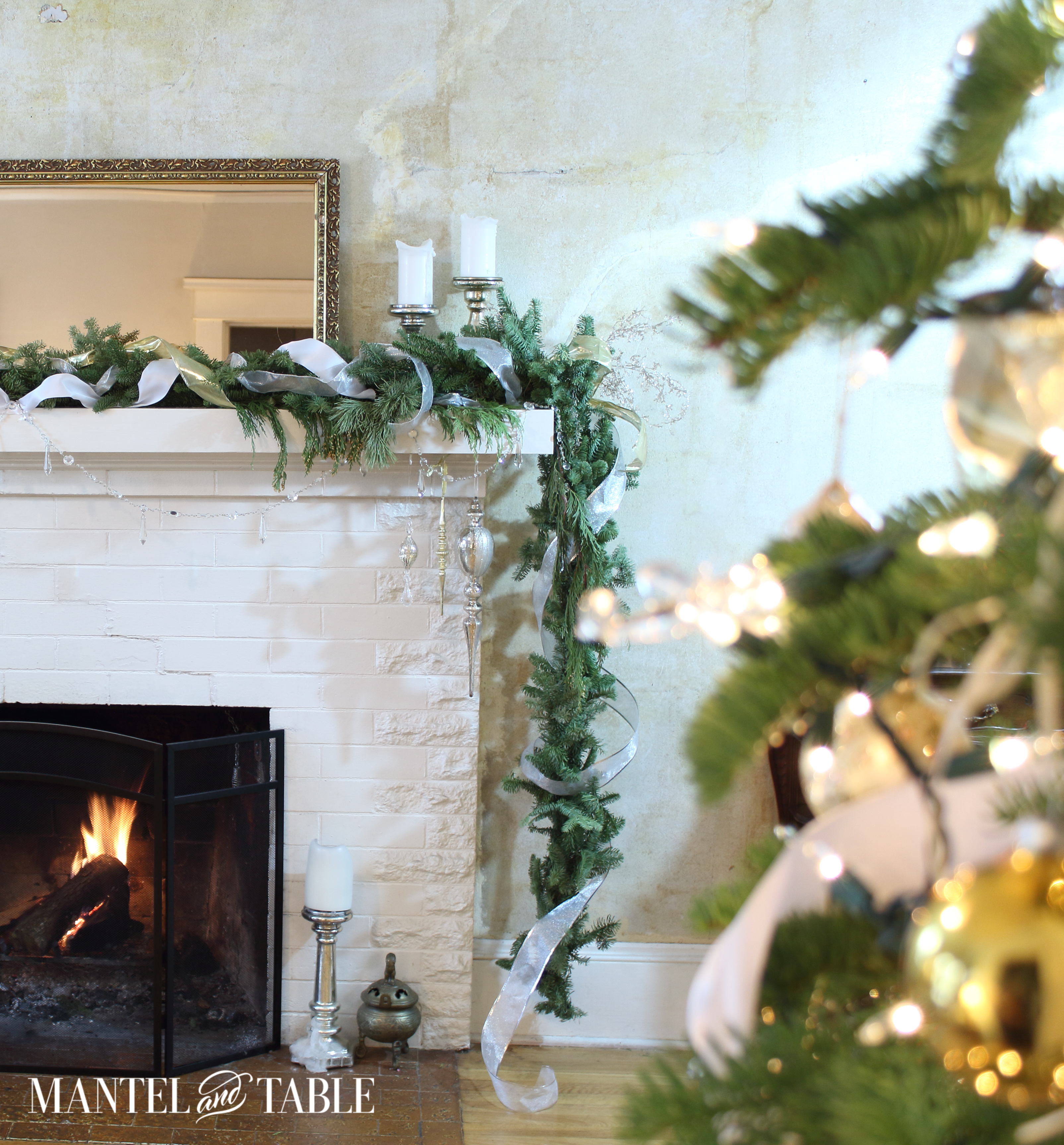 Are you dreaming of a White Christmas Mantel? If so, here's a white, gold, and silver one for a little decorating inspiration!