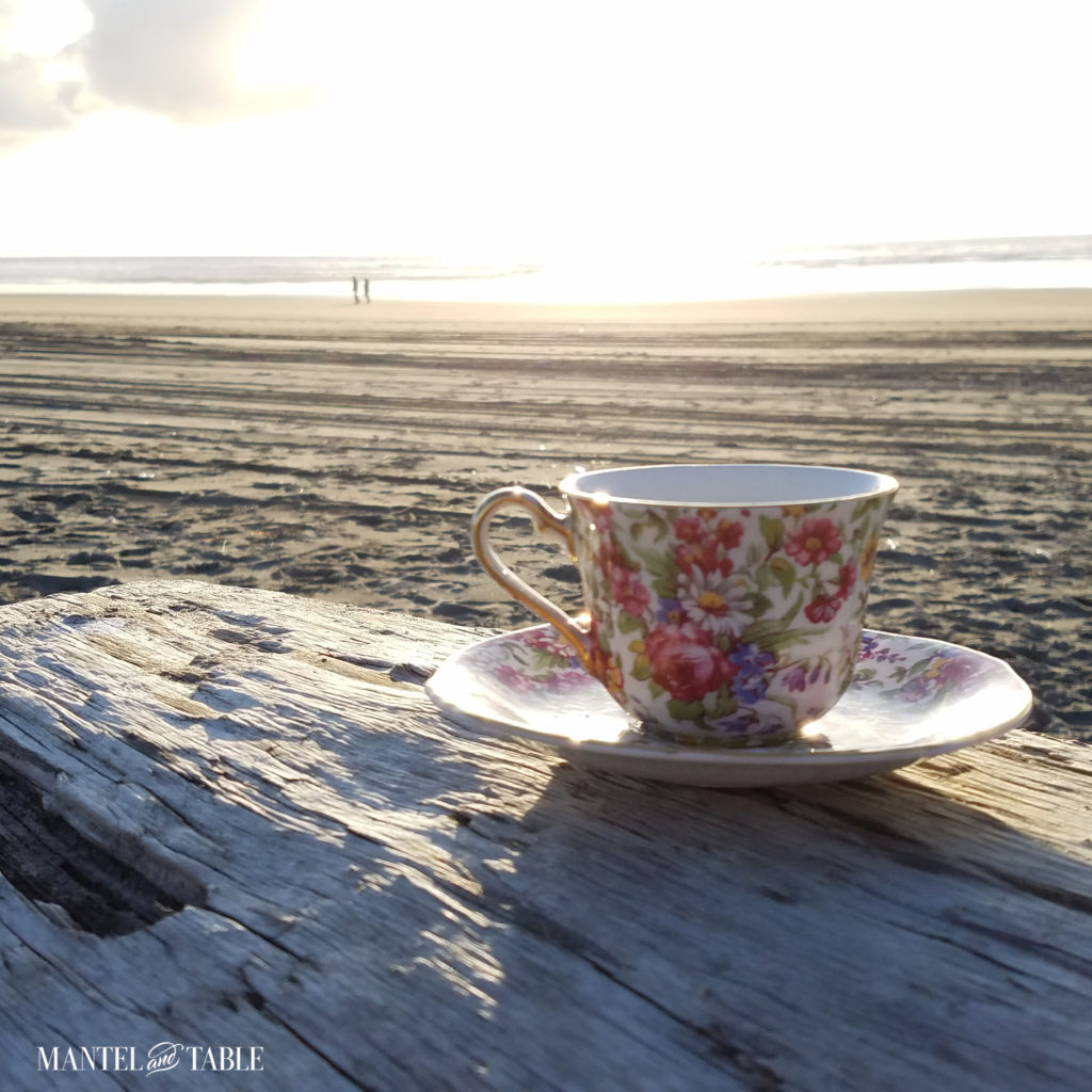 teacup on the beach at sunset