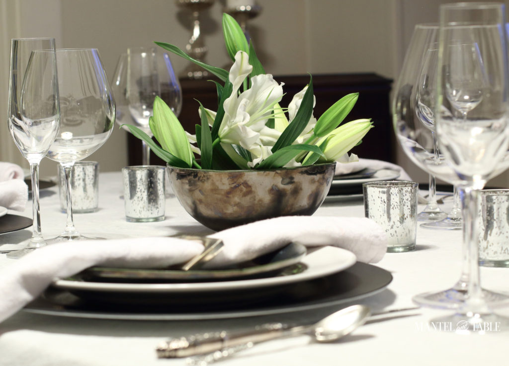 Black & white industrial table setting with centerpiece of white lilies