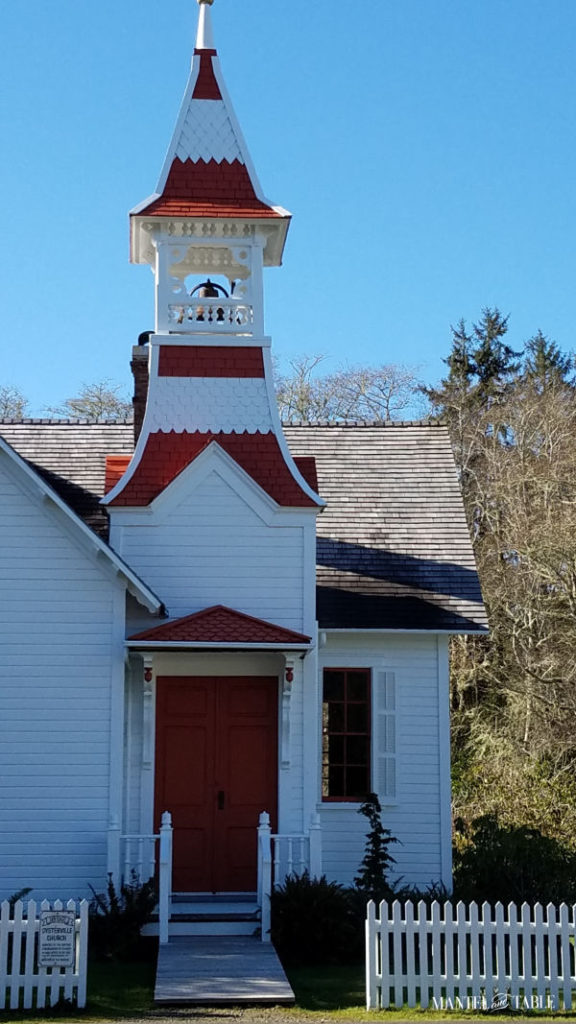White & red Oysterville church with bell tower