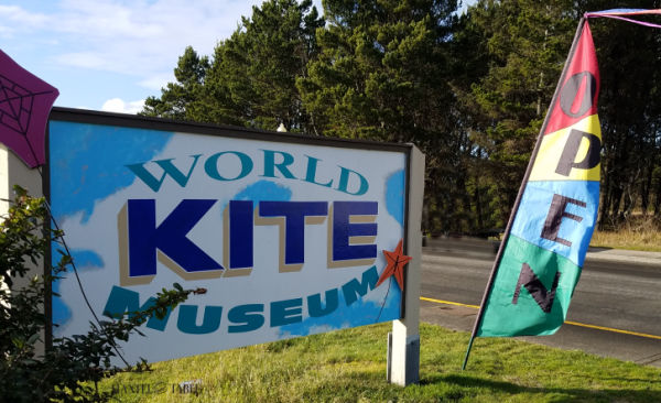 Signage & flag in front of the World Kite Museum