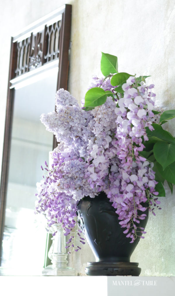 Decorate with flowers - purple wisteria & lilacs in vase