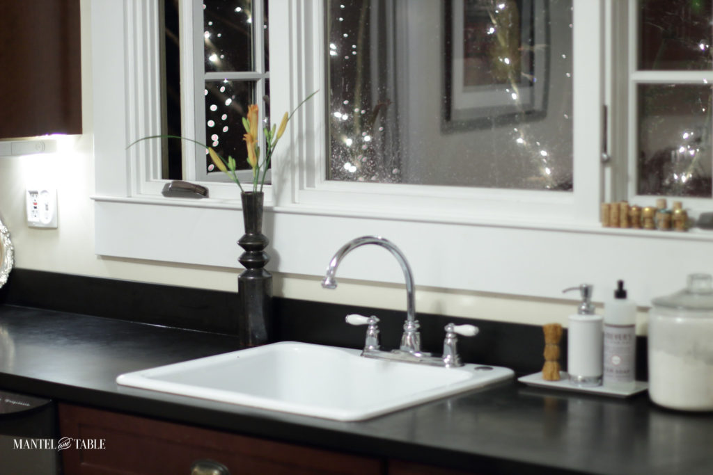 Clean counters, sparkle lights, and vase of flowers