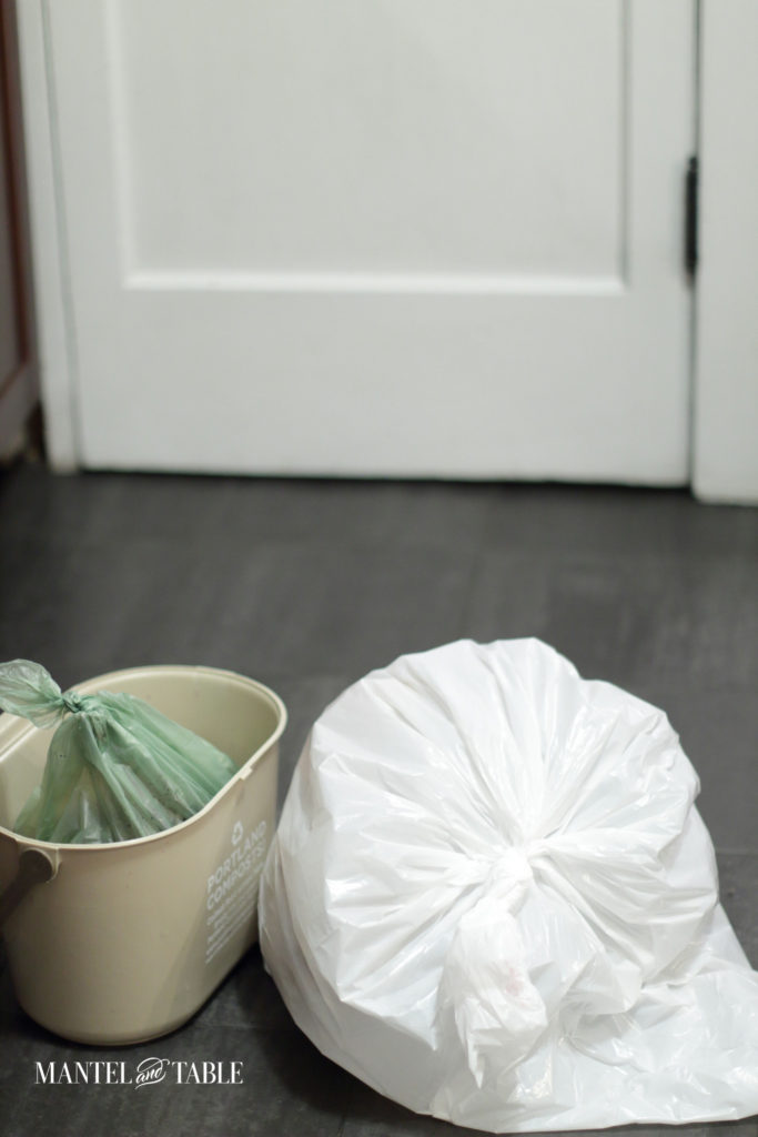 Garbage bag and compost bucket ready to go to the bins
