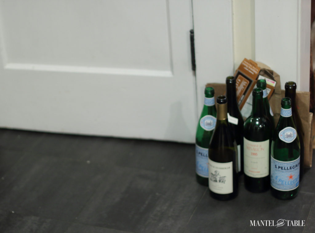 Group of bottles and papers to be recycled during dinner party clean up