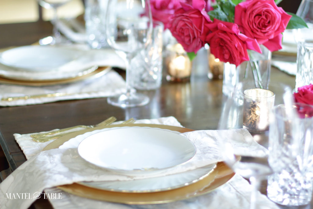 Two places in tablescape. Deep pink roses.