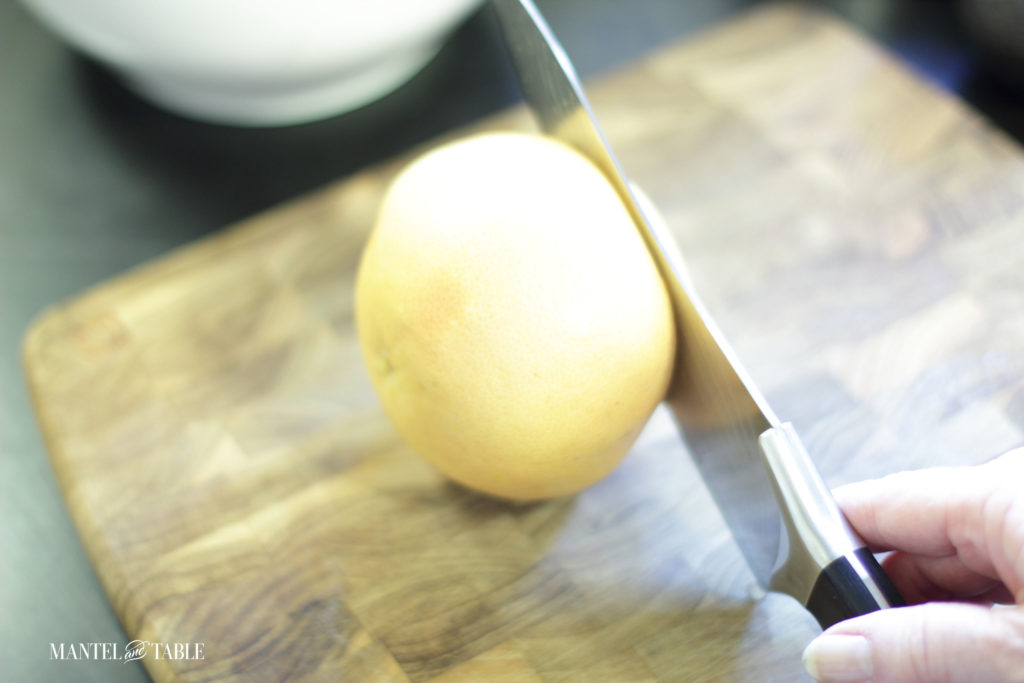 Cutting the ends off the grapefruit