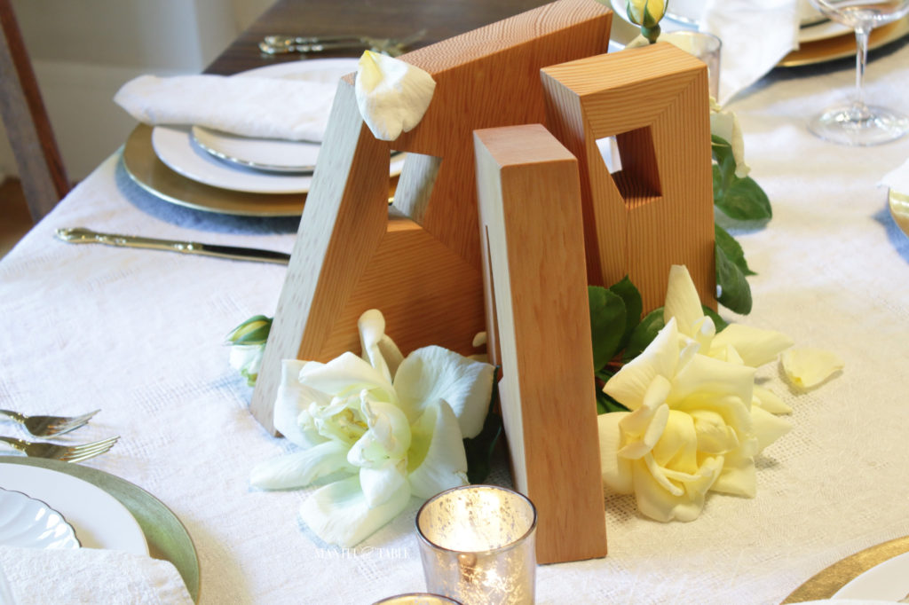 Top view of wooden work of art centerpiece & yellow roses
