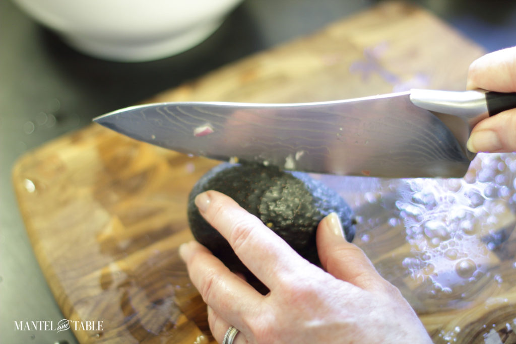 Cutting the avocado for grapefruit avocado salad