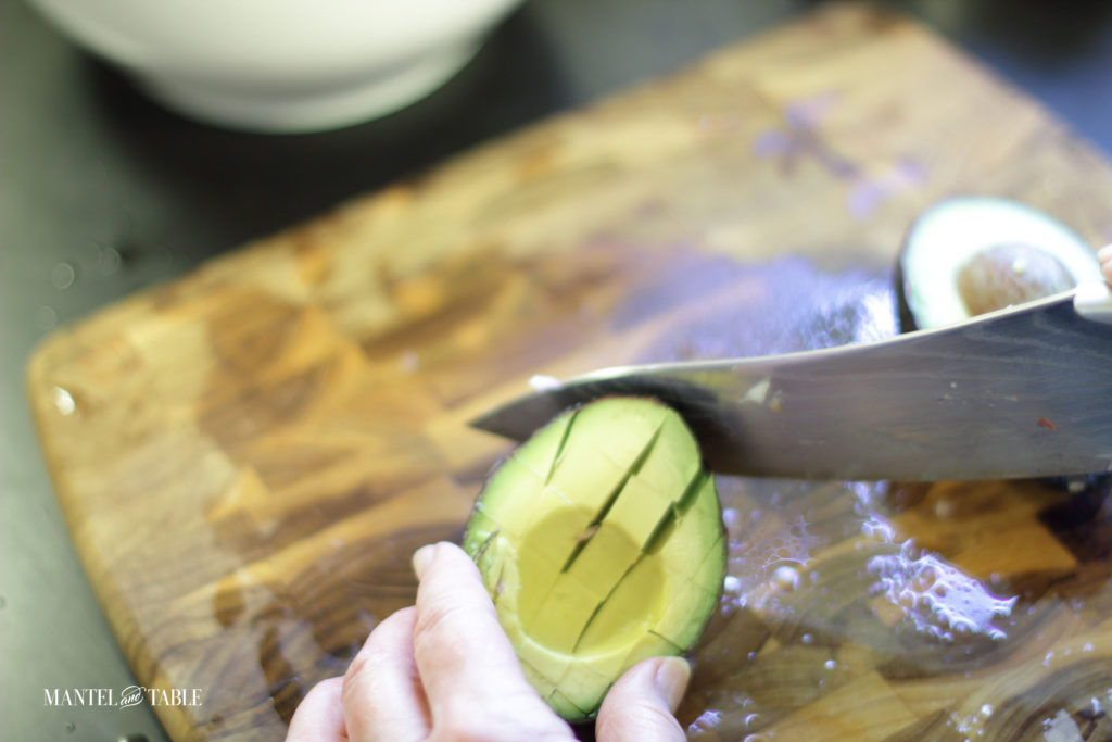 Slicing the avocado slices into squares