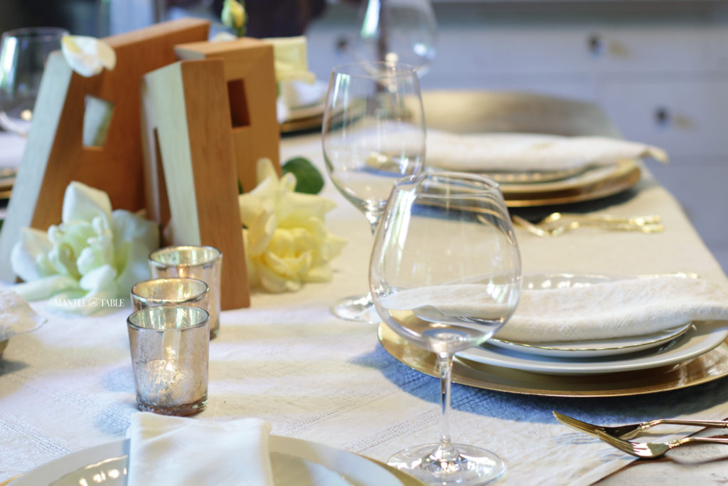 Tablesetting with streamlined wine glasses prominent