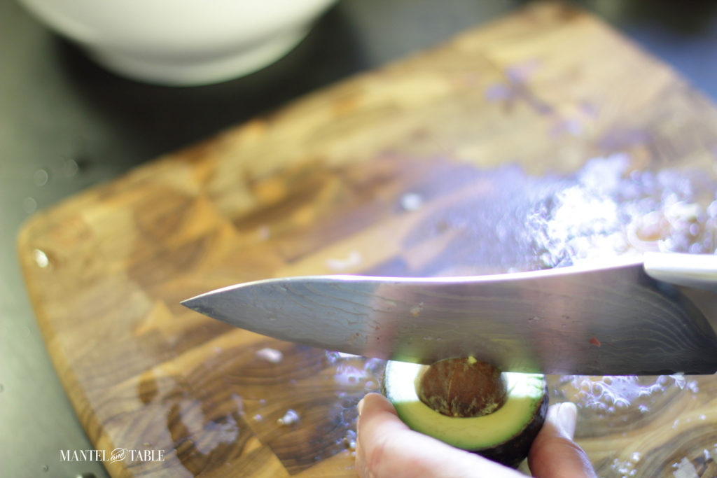 Whacking the knife into the avocado pit (safely of course!)