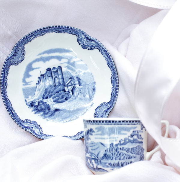 Johnson Brothers blue demitasse teacup and saucer on pink background