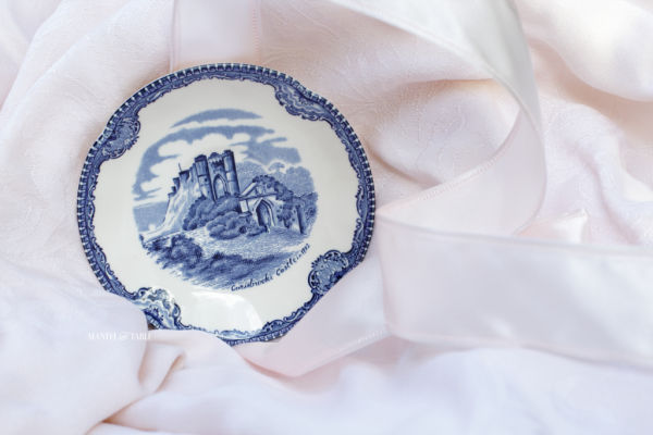 Johnson Brothers Old Britain Castles Blue demitasse saucer on pink ground