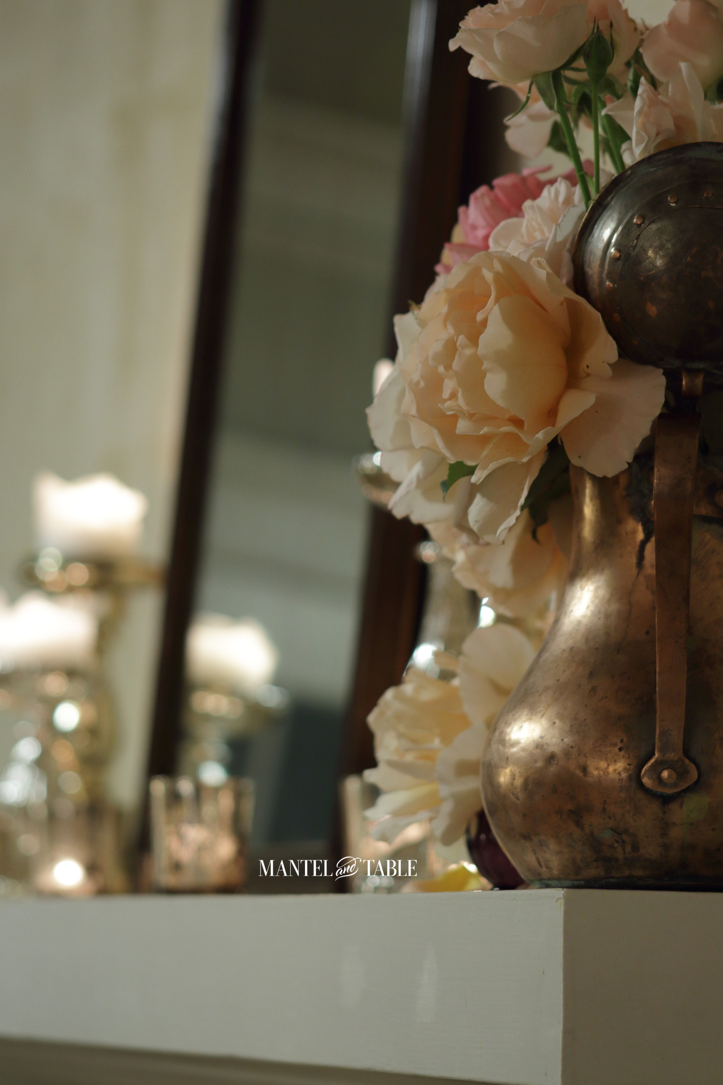 Angle shot of mantel with roses and candles
