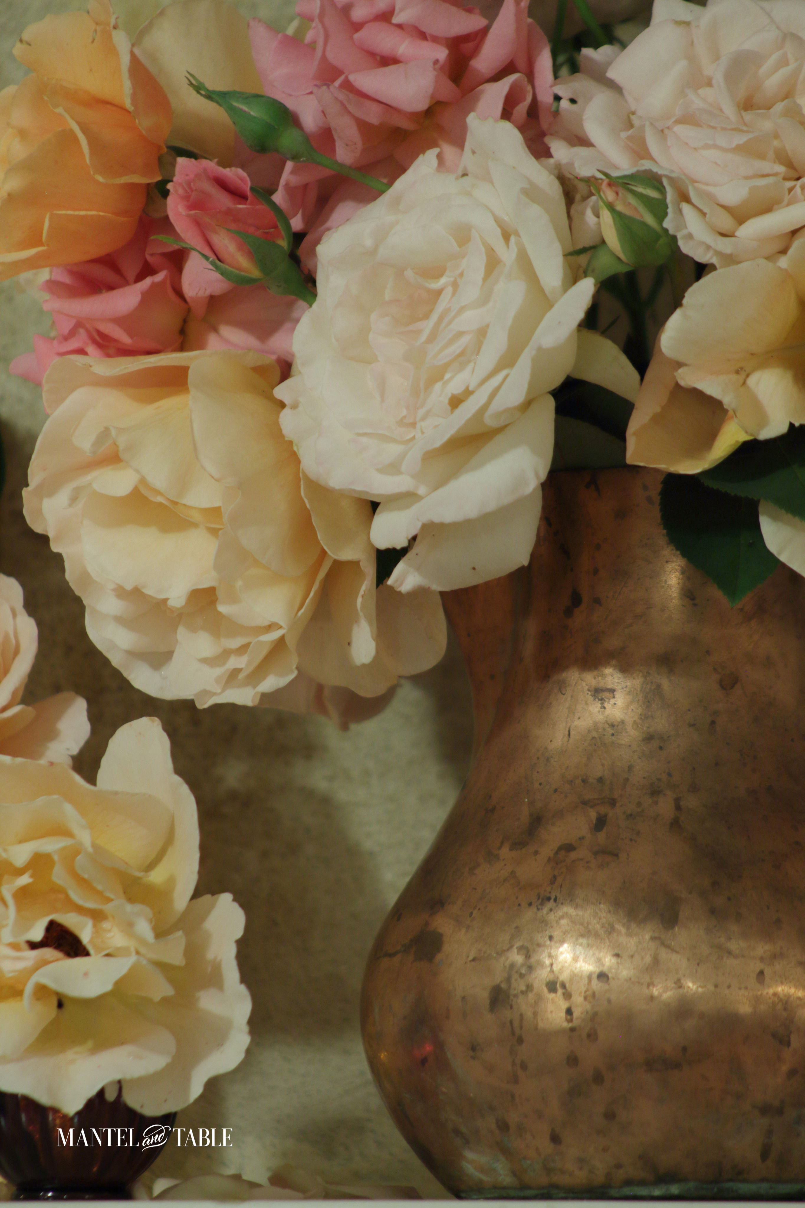 Copper vase of roses