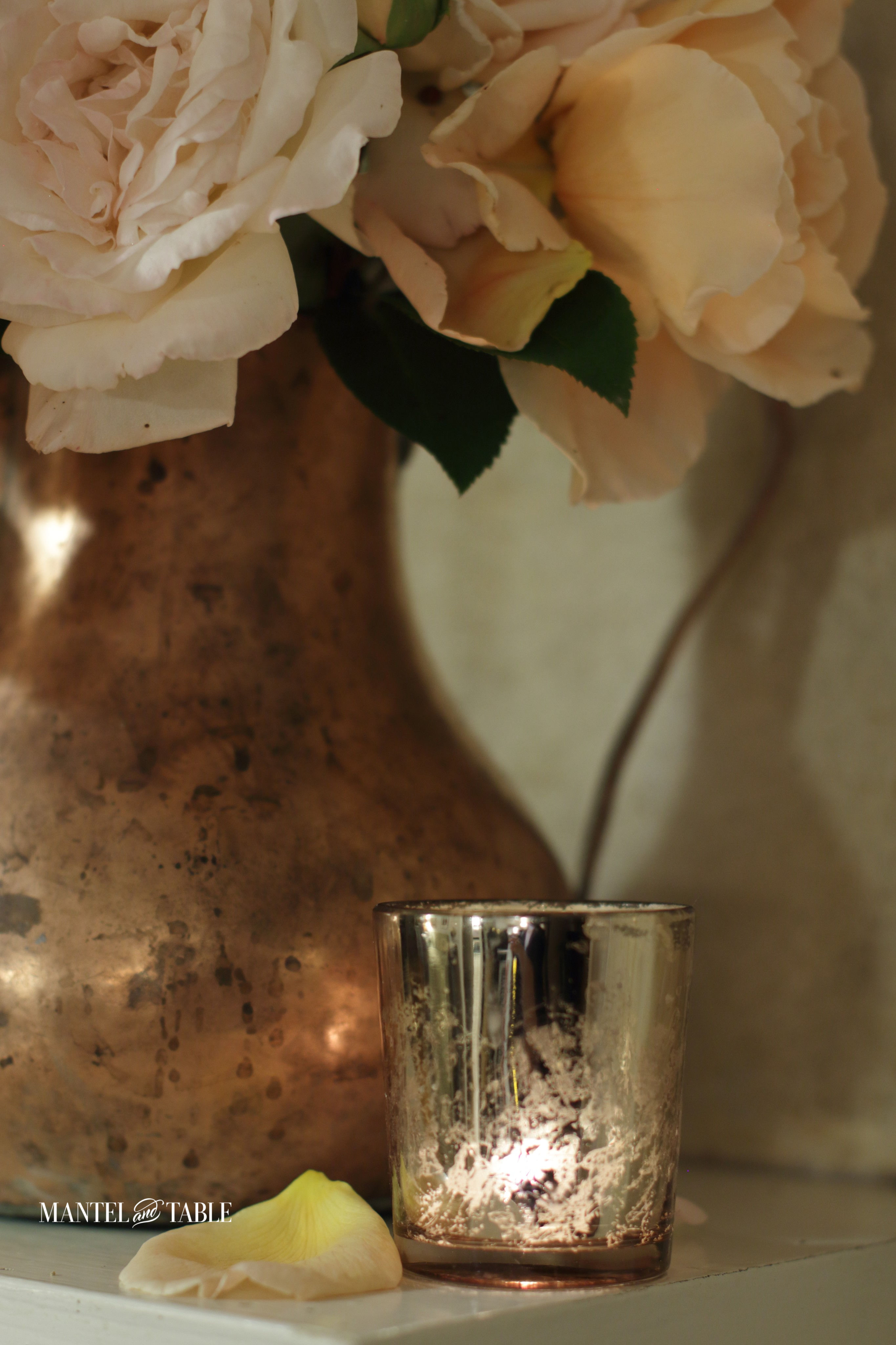Copper vase of peach & cream roses, gold mercury glass votive candle holder