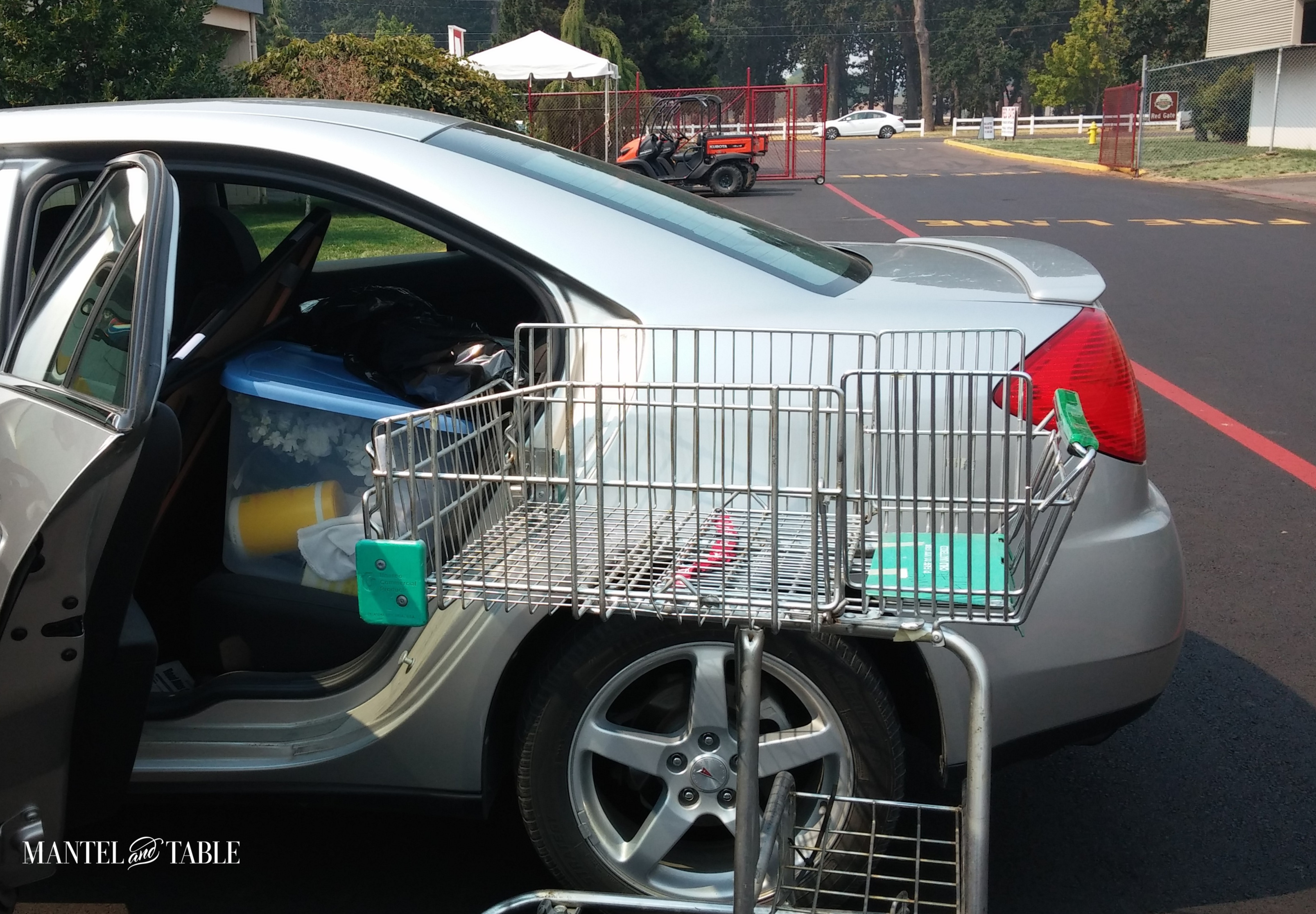 Car packed full of tablescape setup gear. Grocery cart standing by.