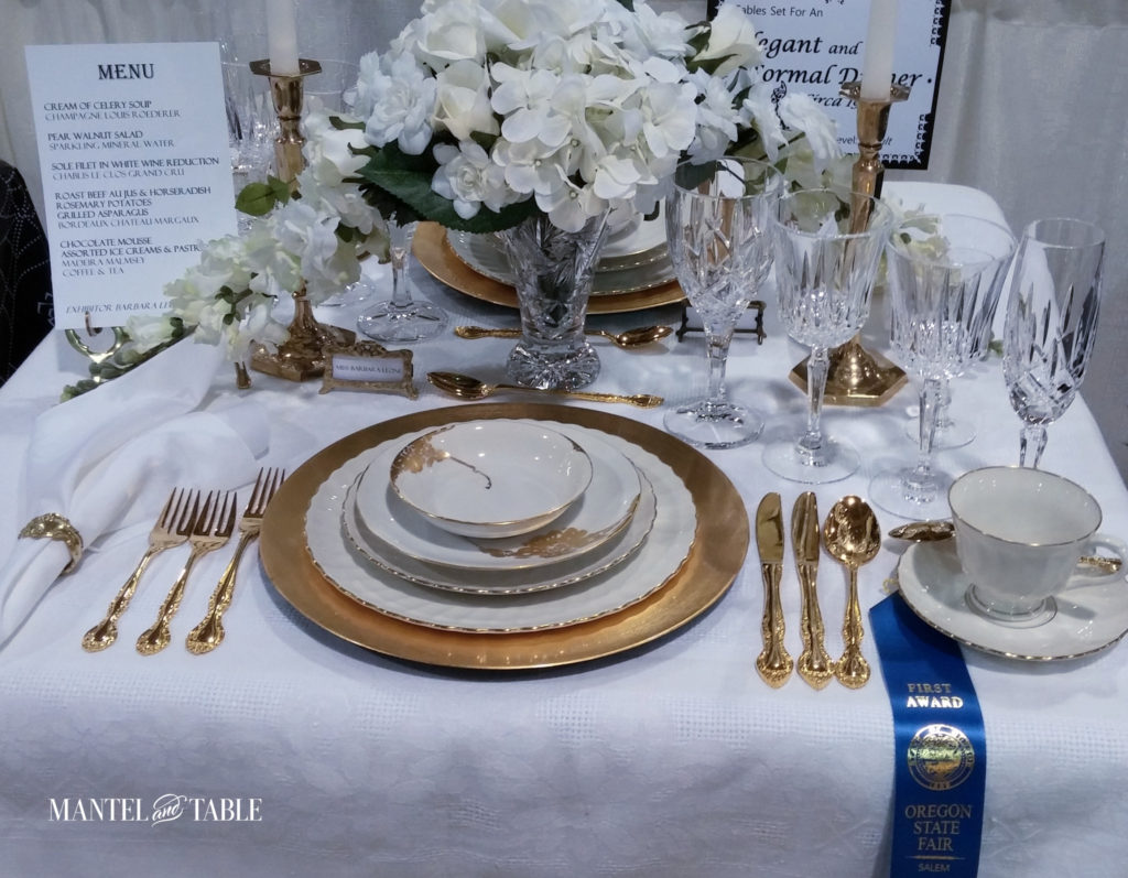 white & gold tablescape competition entry table with 1st prize ribbon