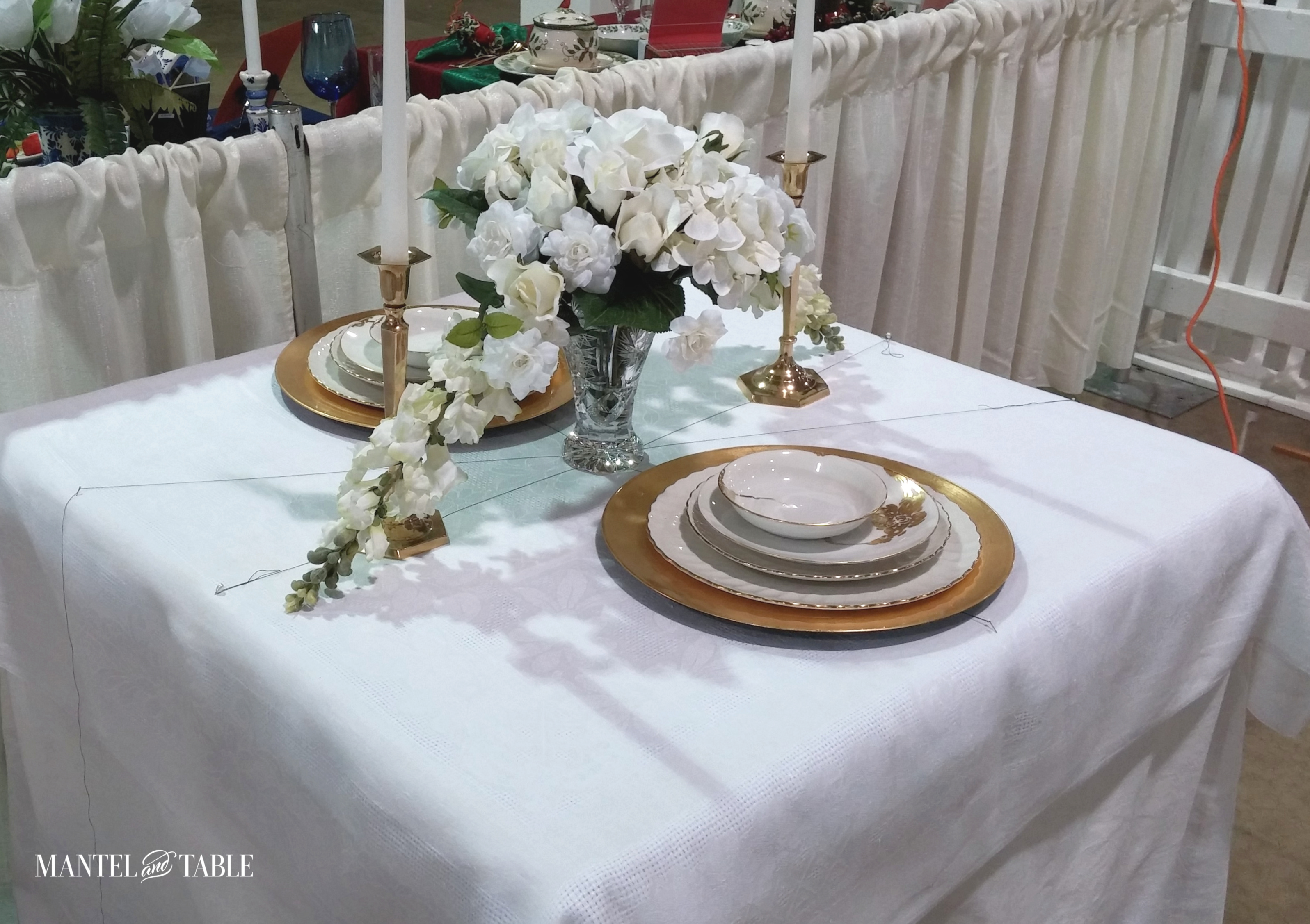 Gold & White plate stack has been added during tablescape setup