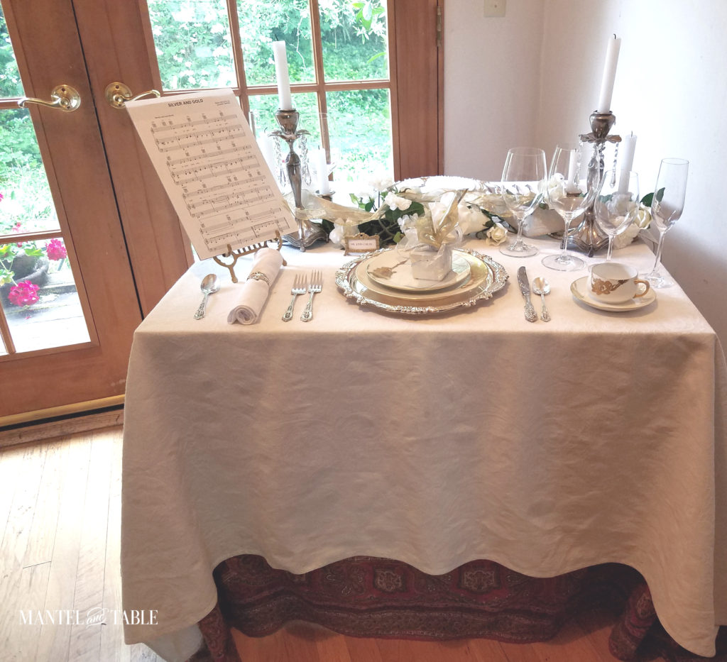 Card table with white silver & gold table setting