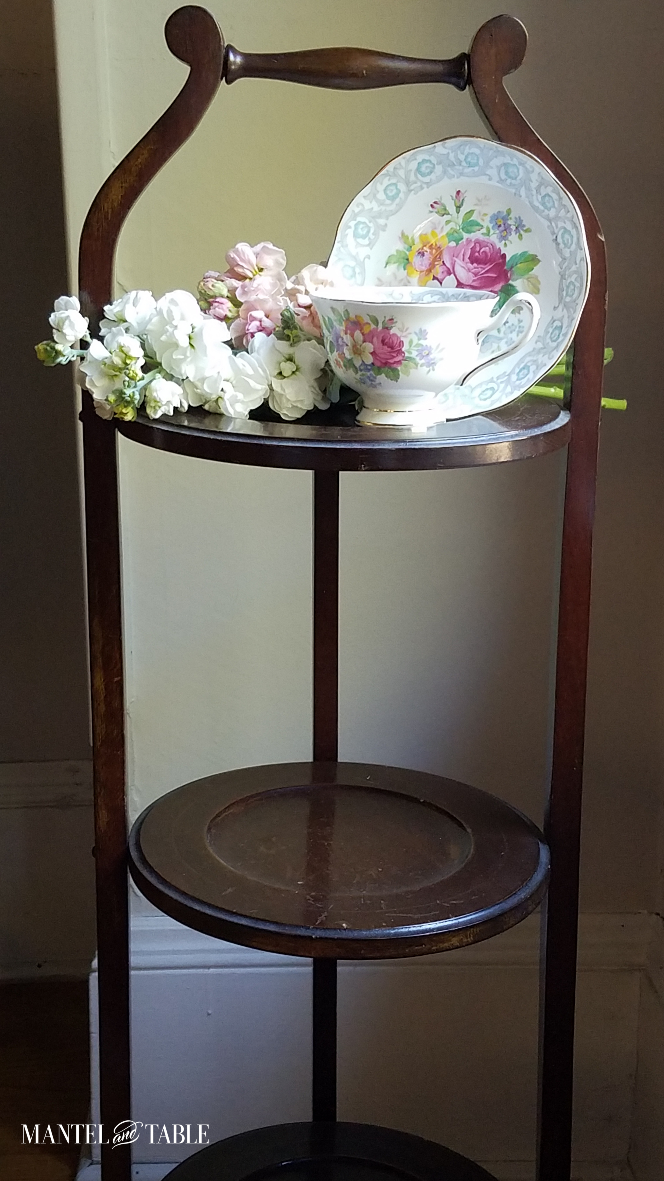 Royal Albert Fragrance teacup and saucer on 3-tiered stand.