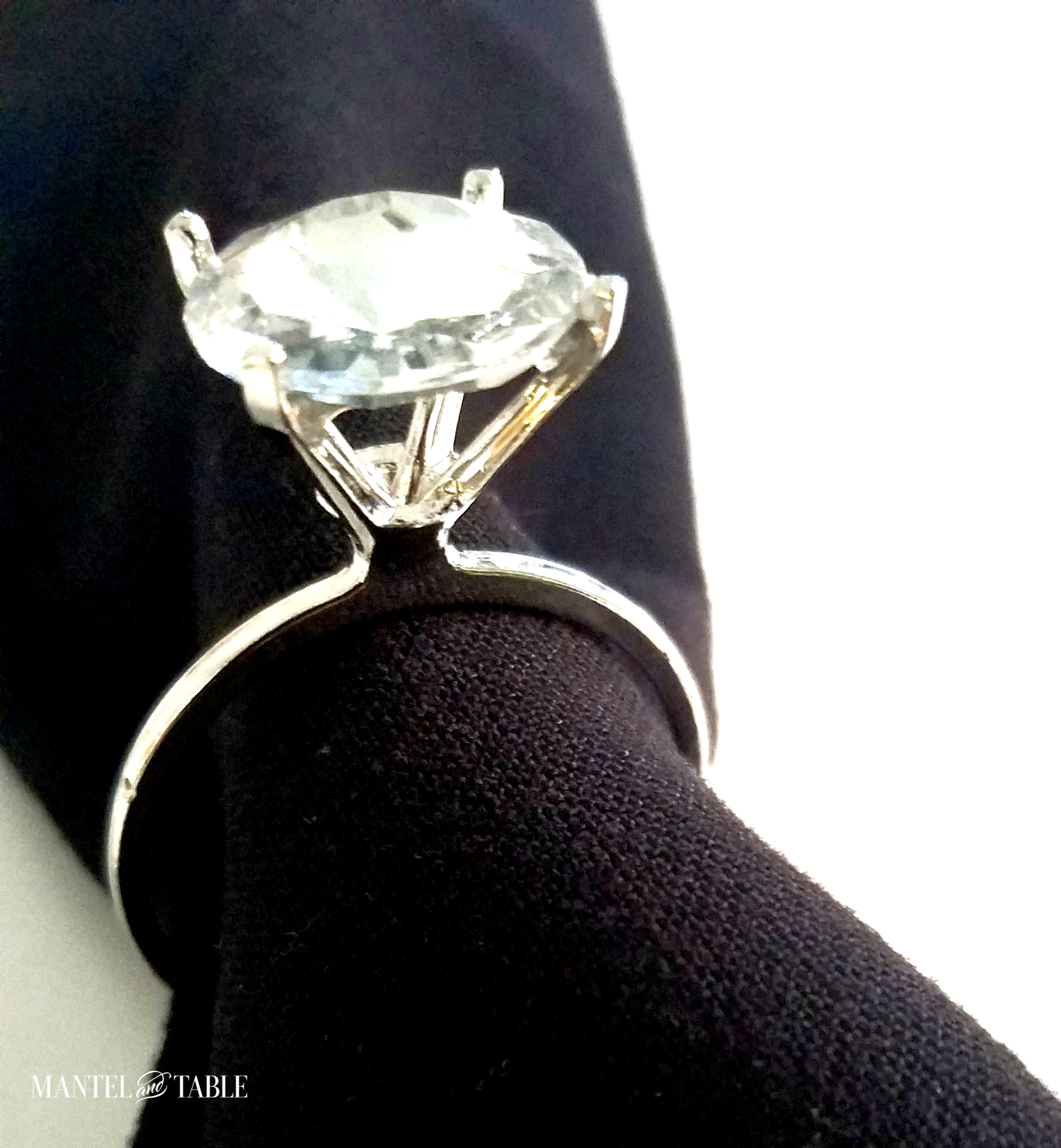 Engagement Dinner Table Setting -silver diamond ring napkin holder on black napkin