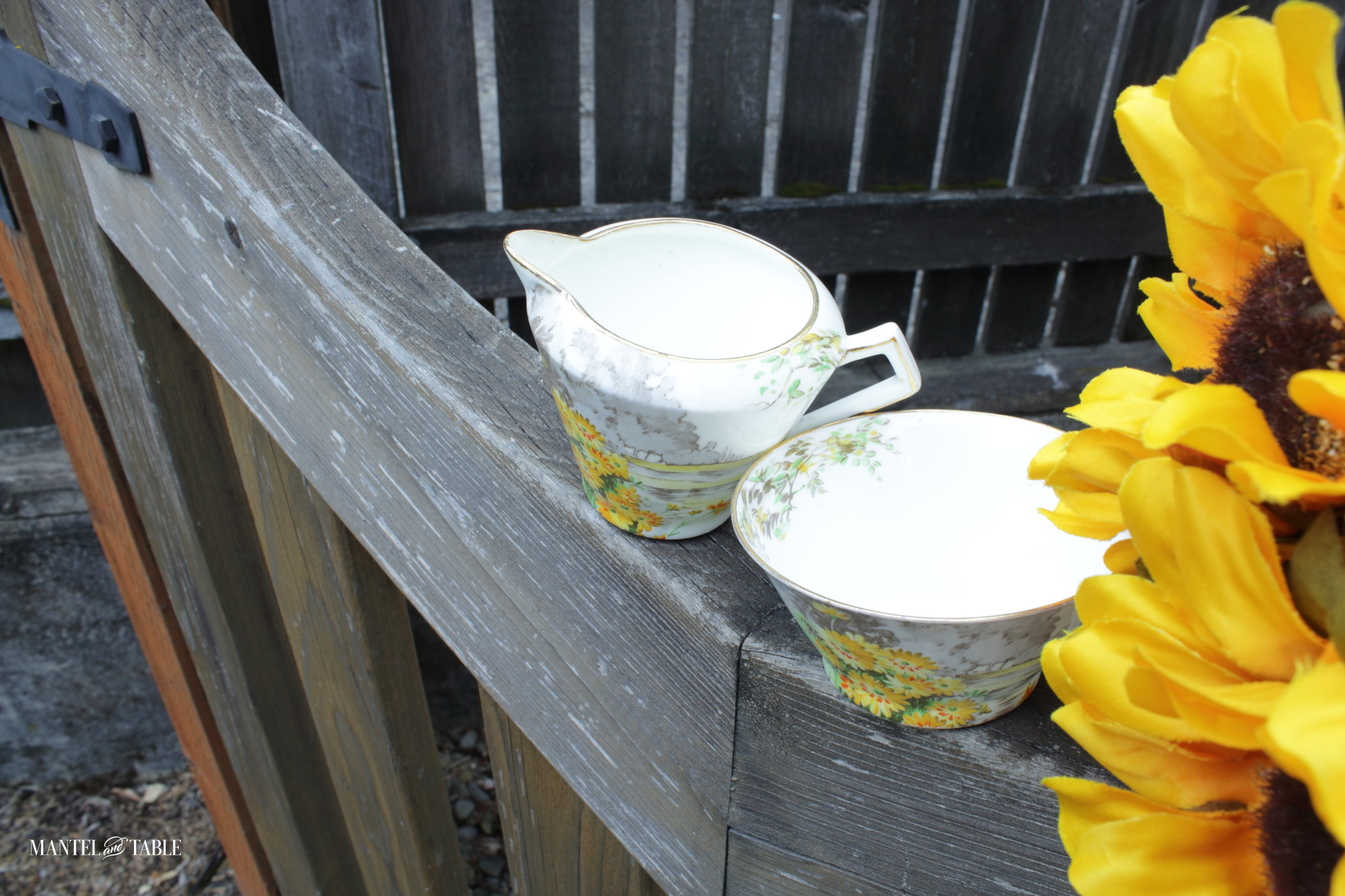 Yellow Morn sugar & creamer on the top of the gate