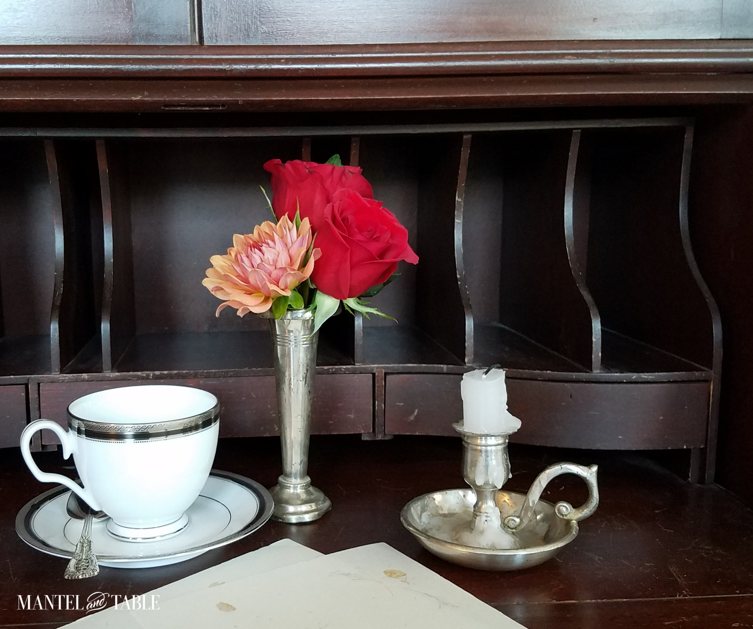 teacup with flowers and candlestick