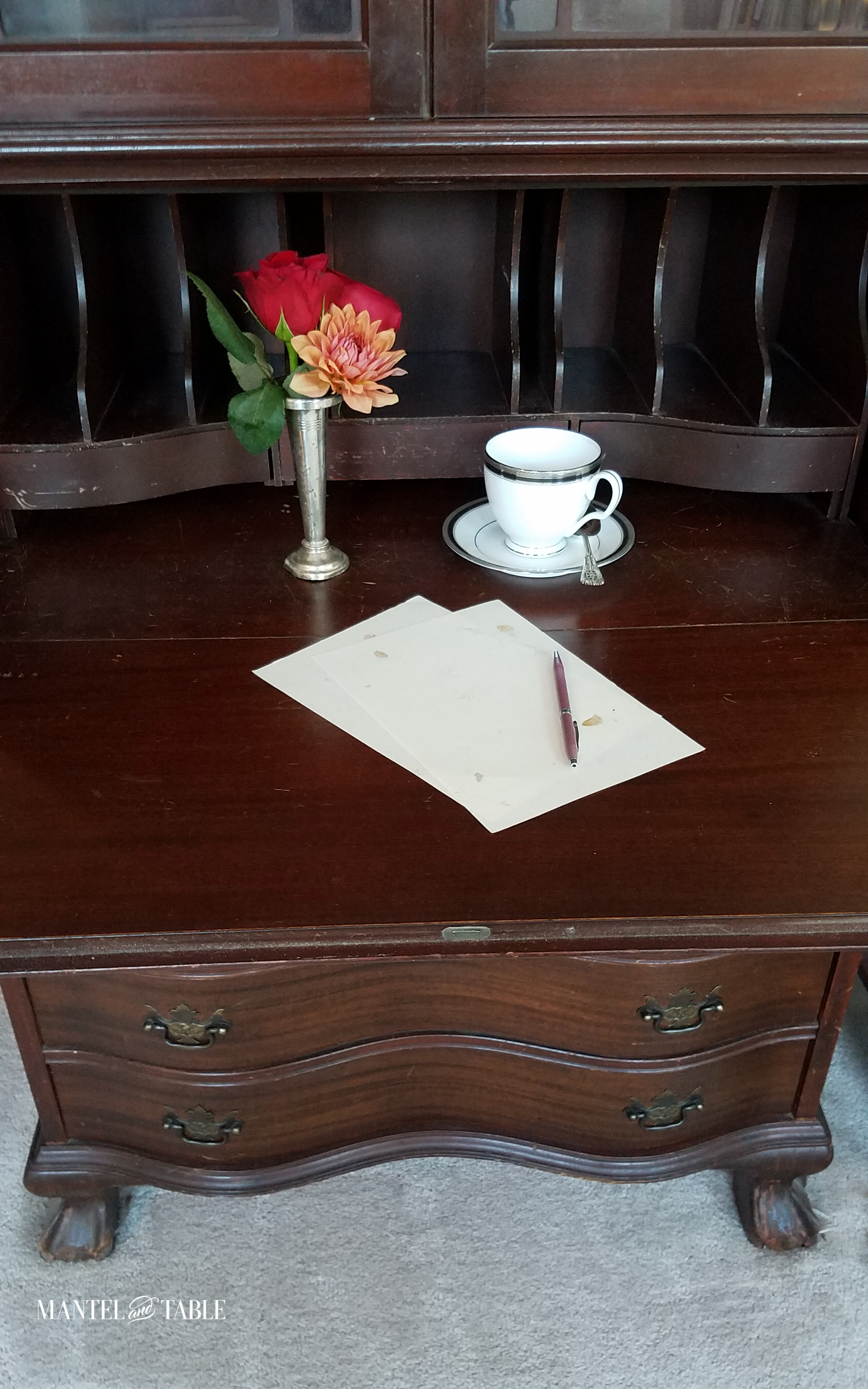 teacup on vintage secretary desk