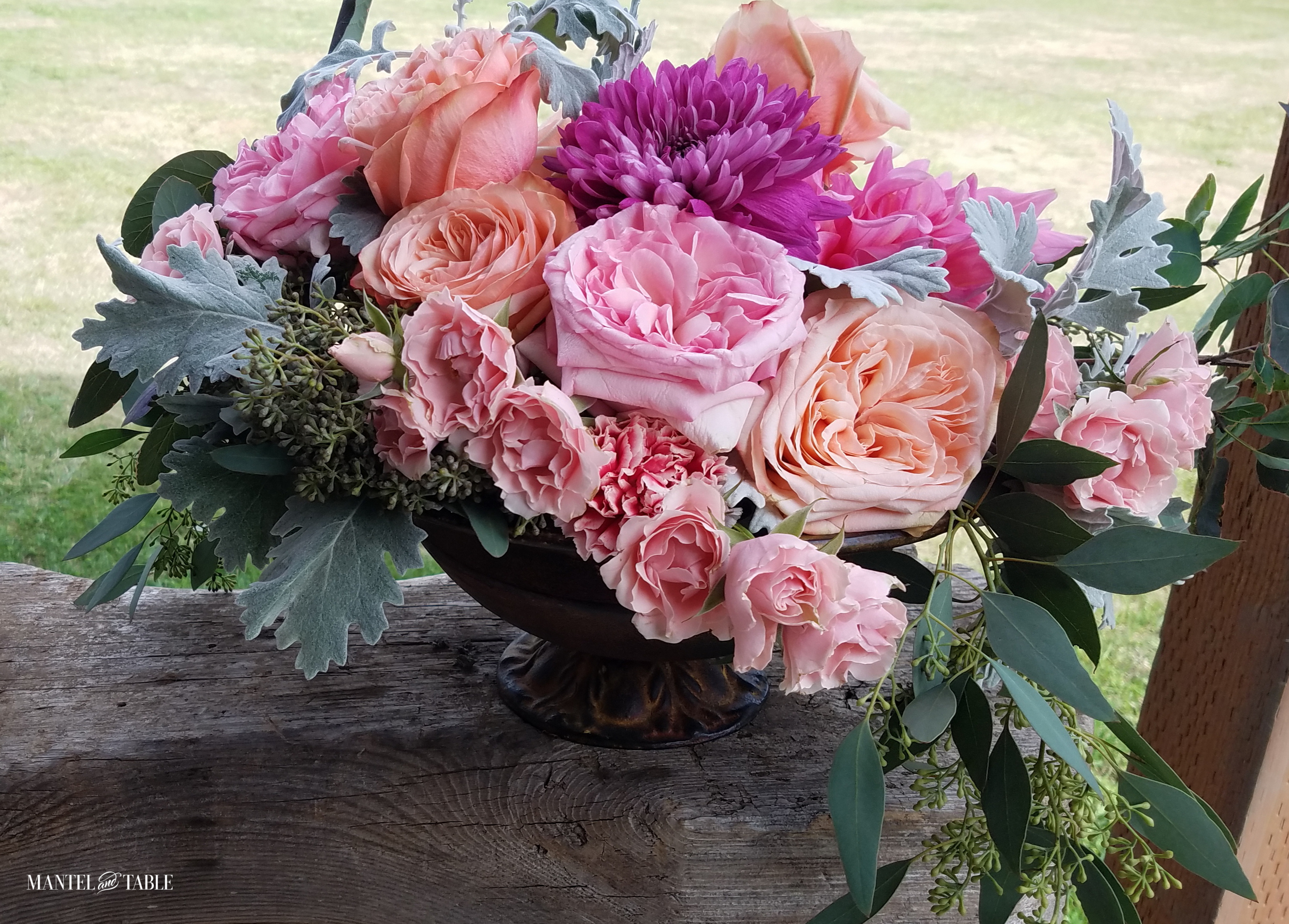 pink & blush rose flower arrangement on weathered wood