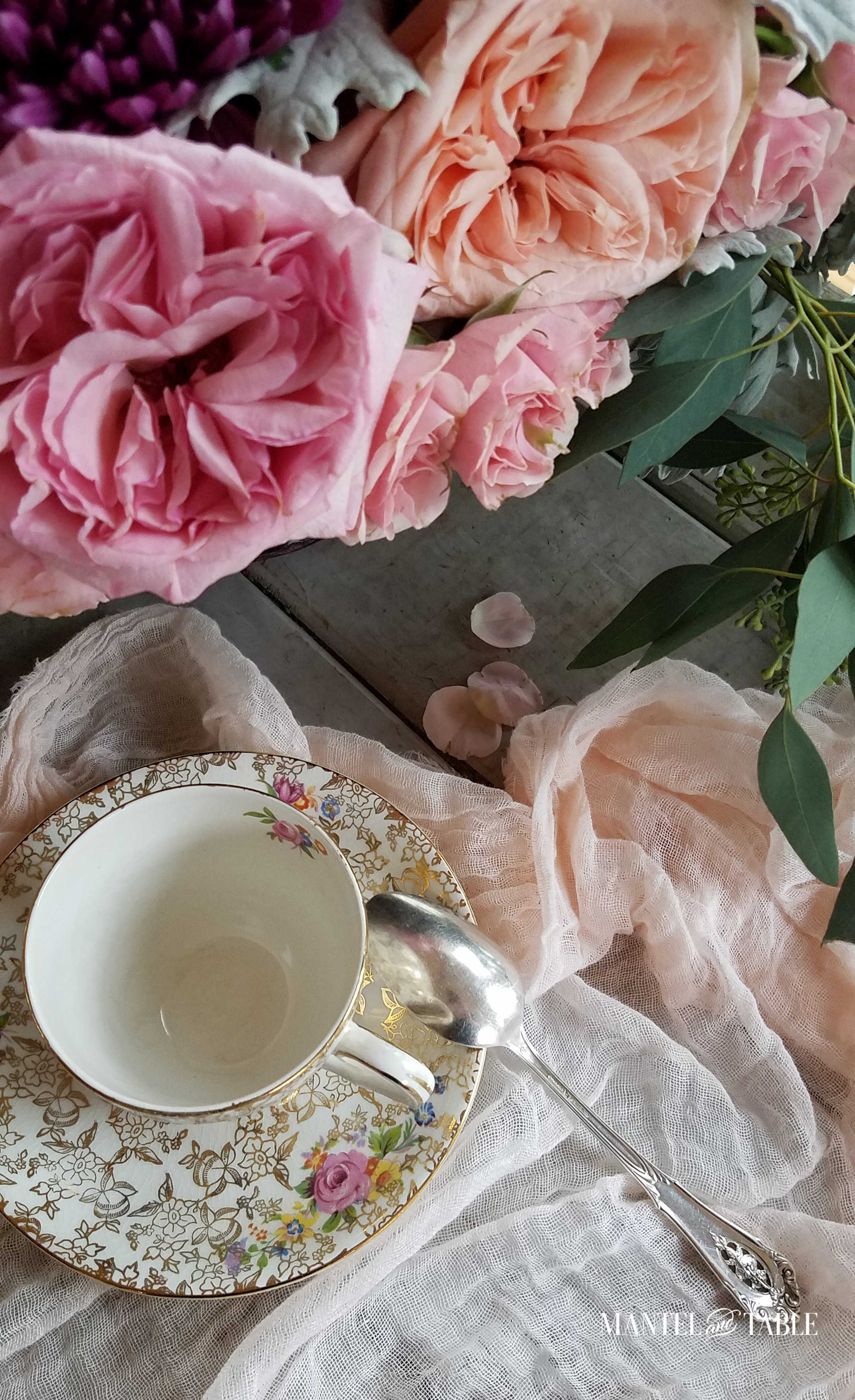 gold & floral teacup with roses and silver spoon