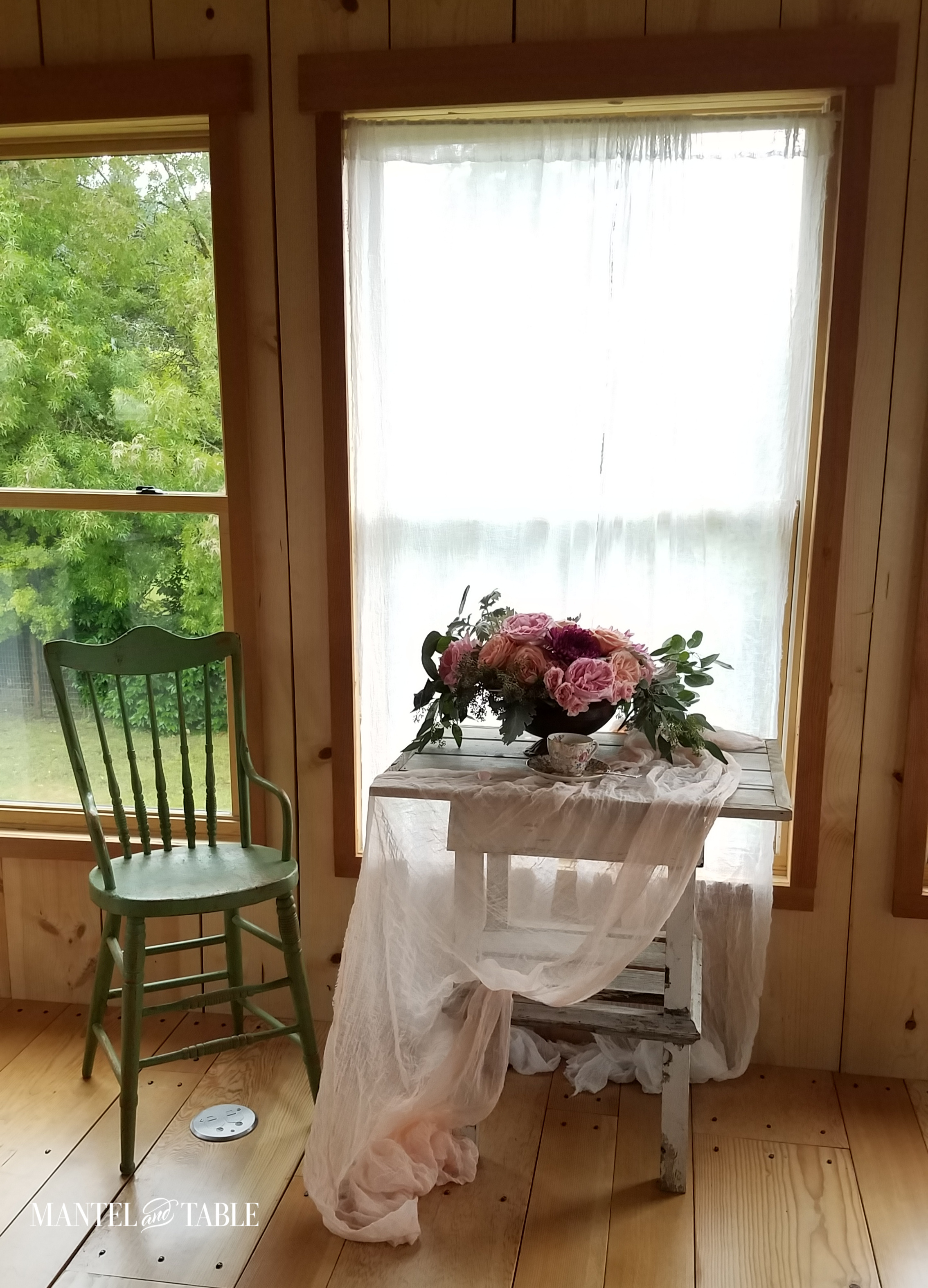 vintage teacup on table with green chair