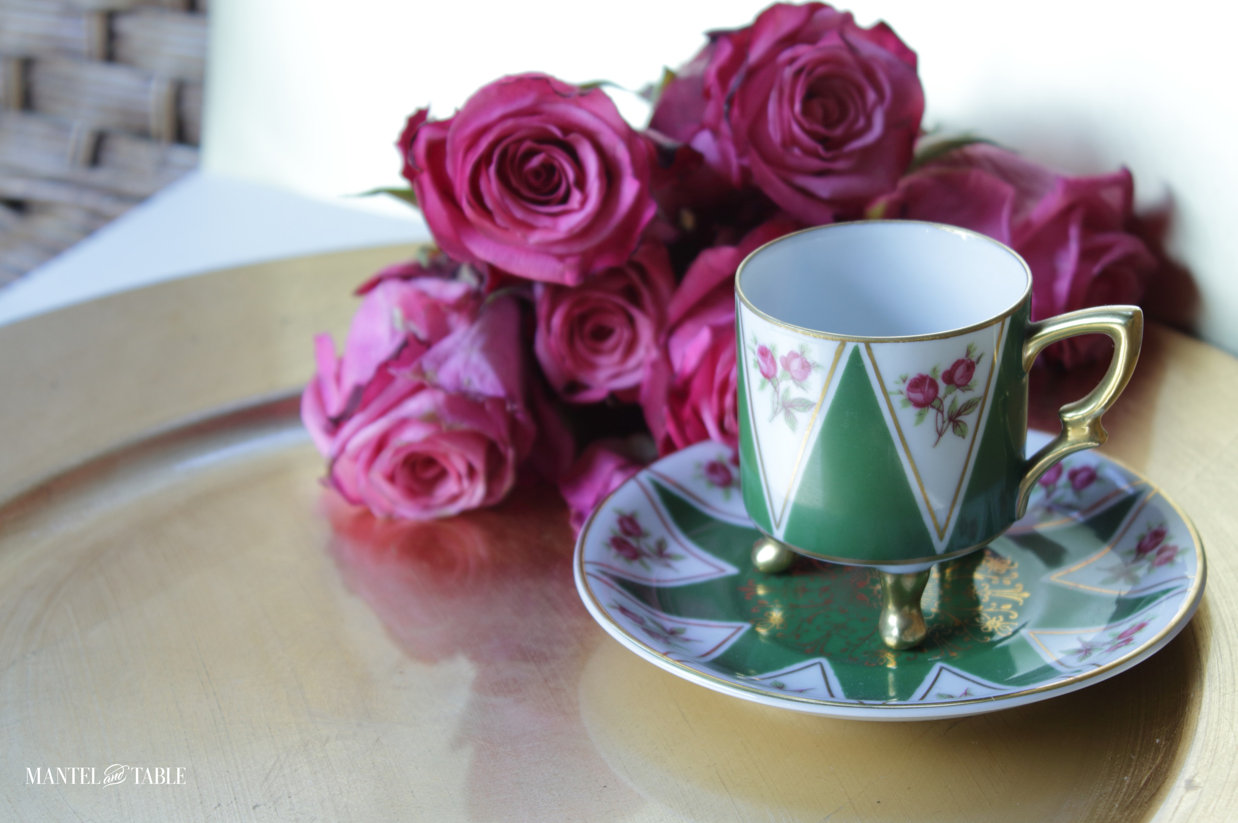 Close up of teacup arrangement on wicker love seat