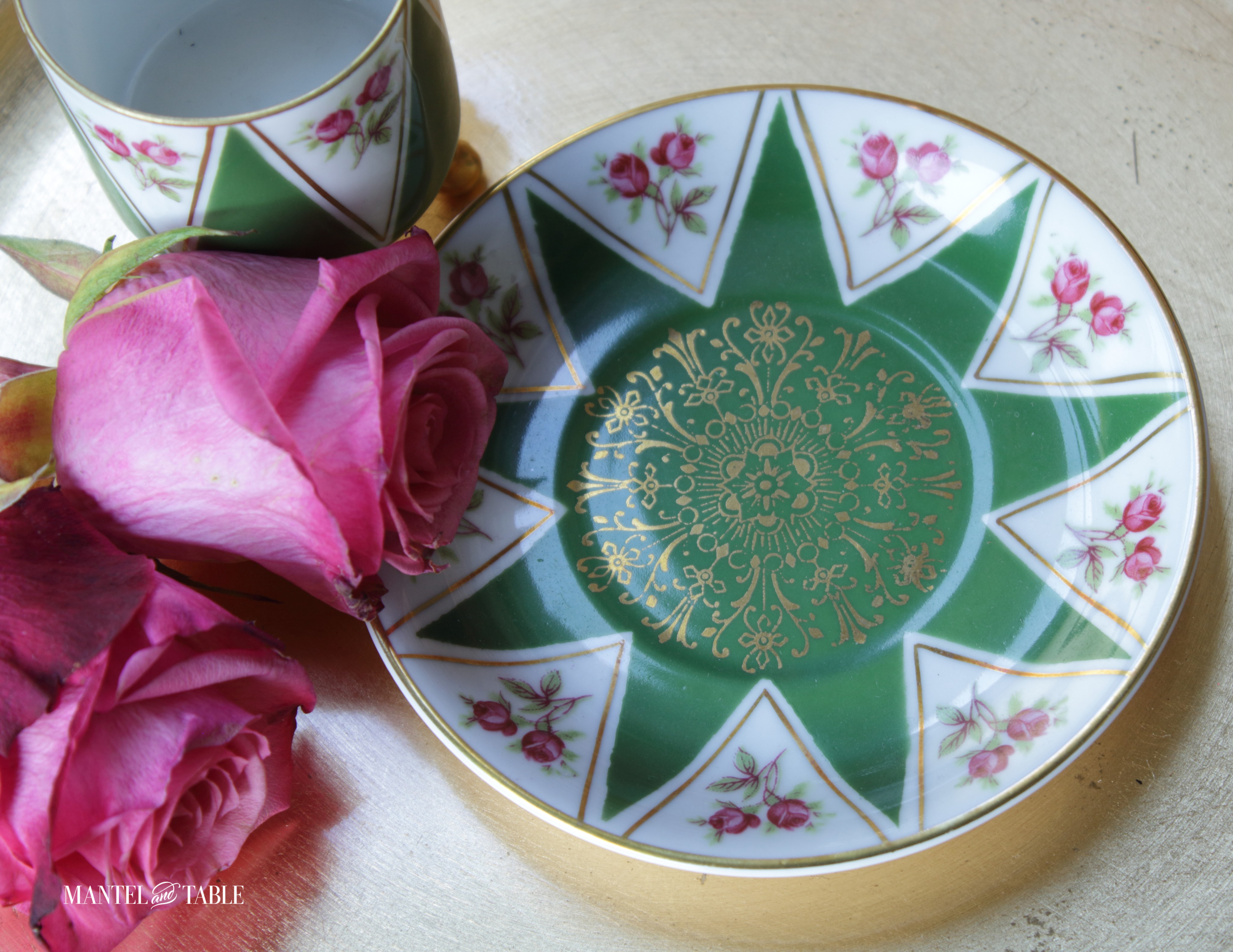 Green & white triangles on gold rimmed saucer with pink roses