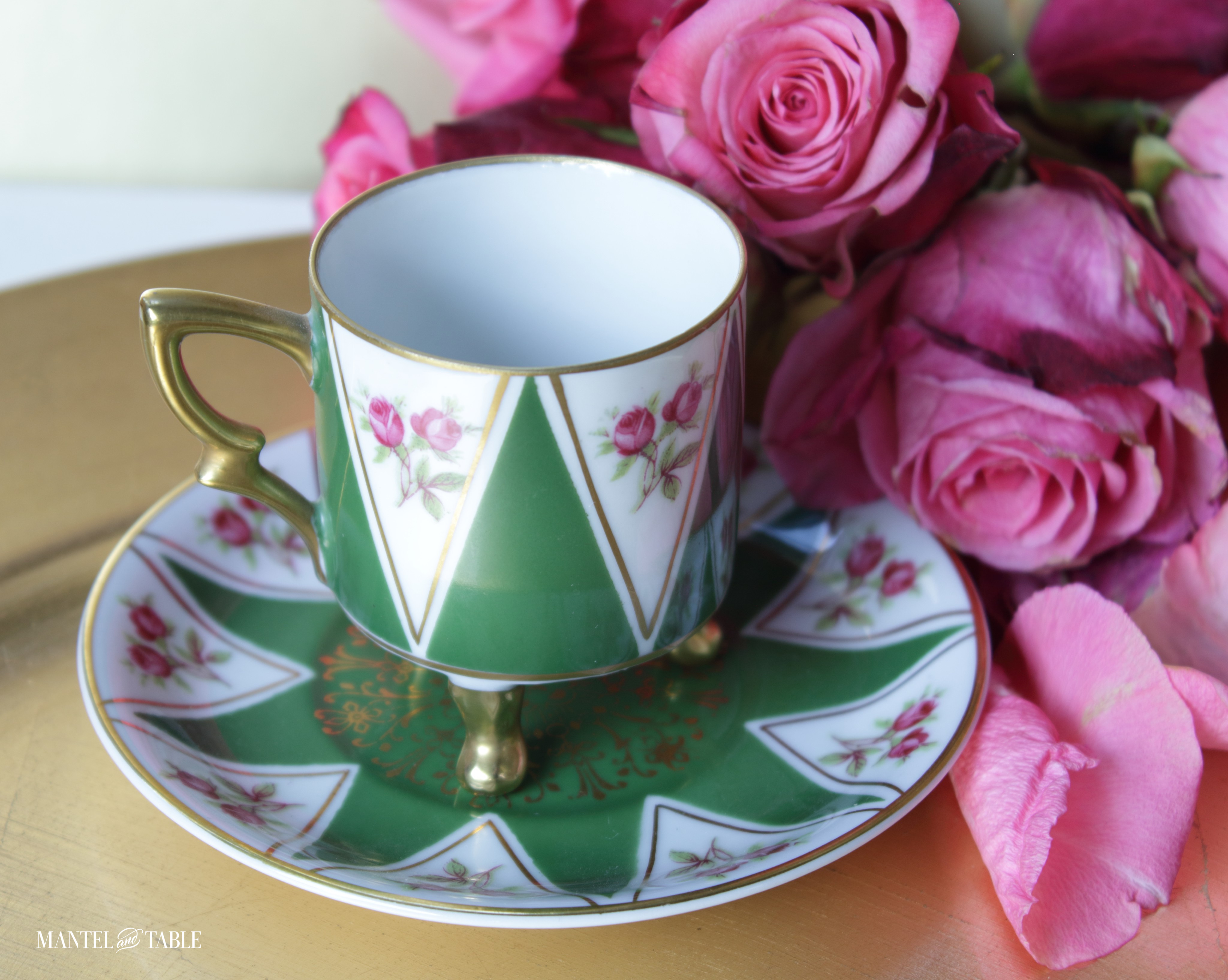 Even closer up of demitasse teacup and roses
