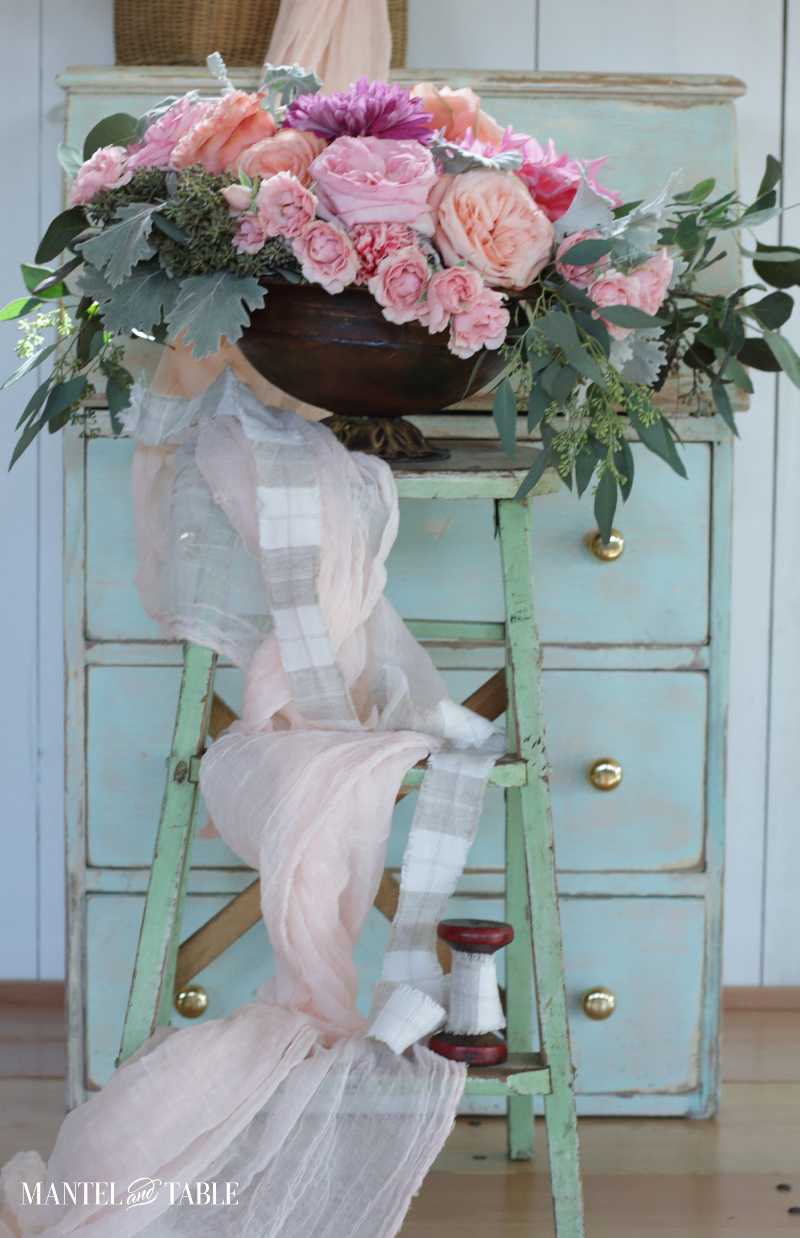 Flower arrangement on a step stool.