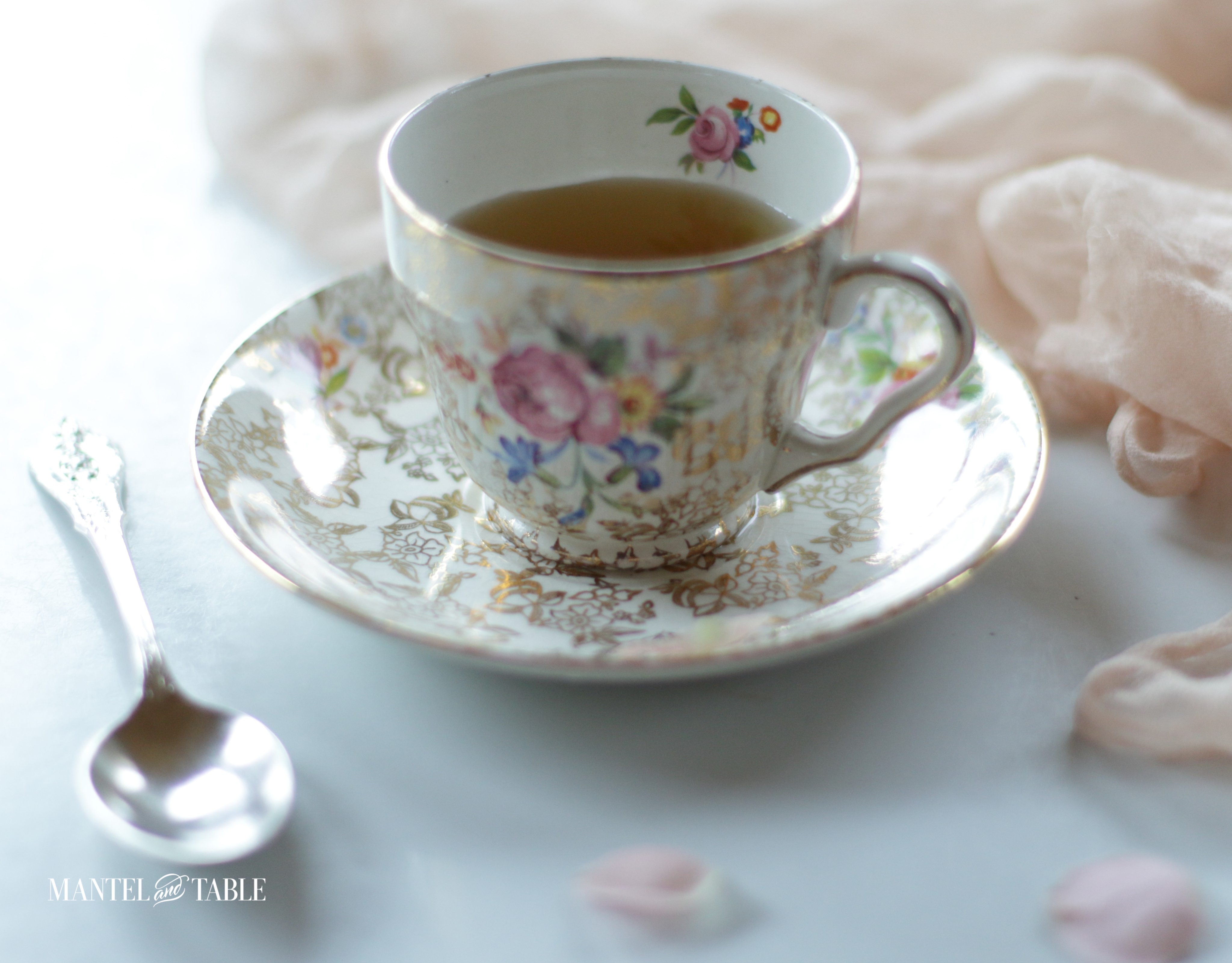 vintage teacup & saucer with rose petals