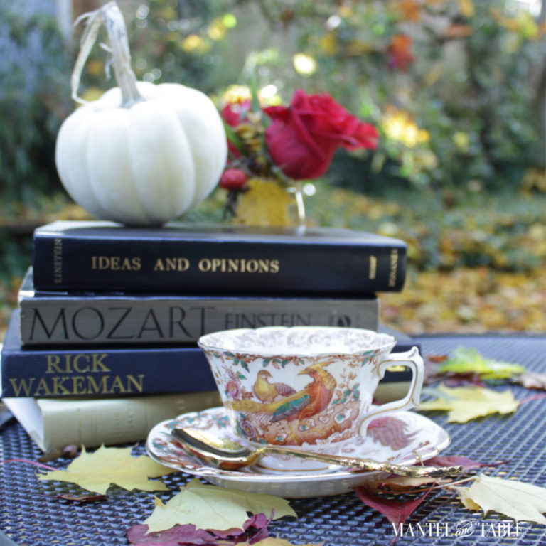 Royal Crown Derby teacup with books, white pumpkin, red roses