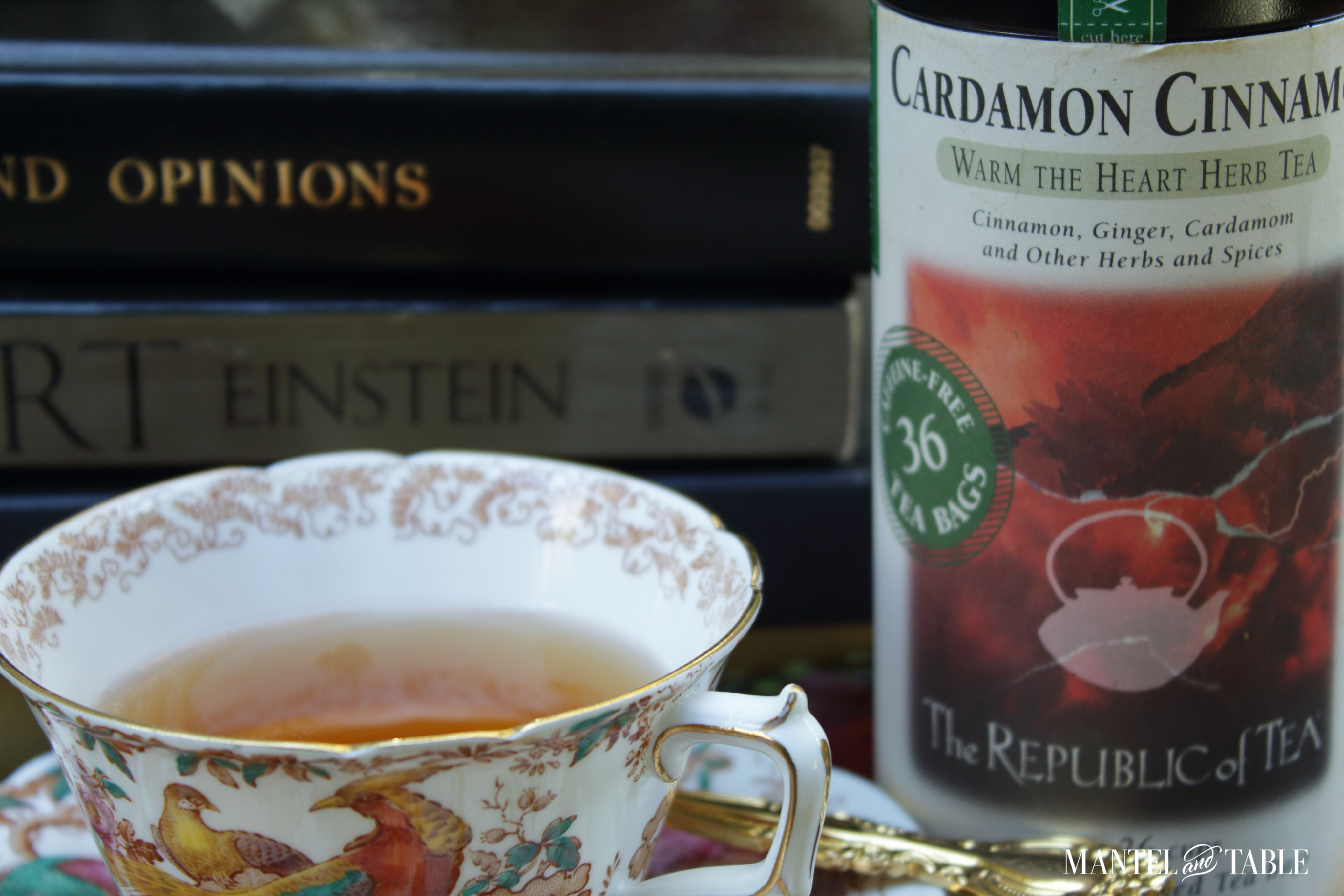 Closeup of Royal Crown Derby teacup and tin of tea