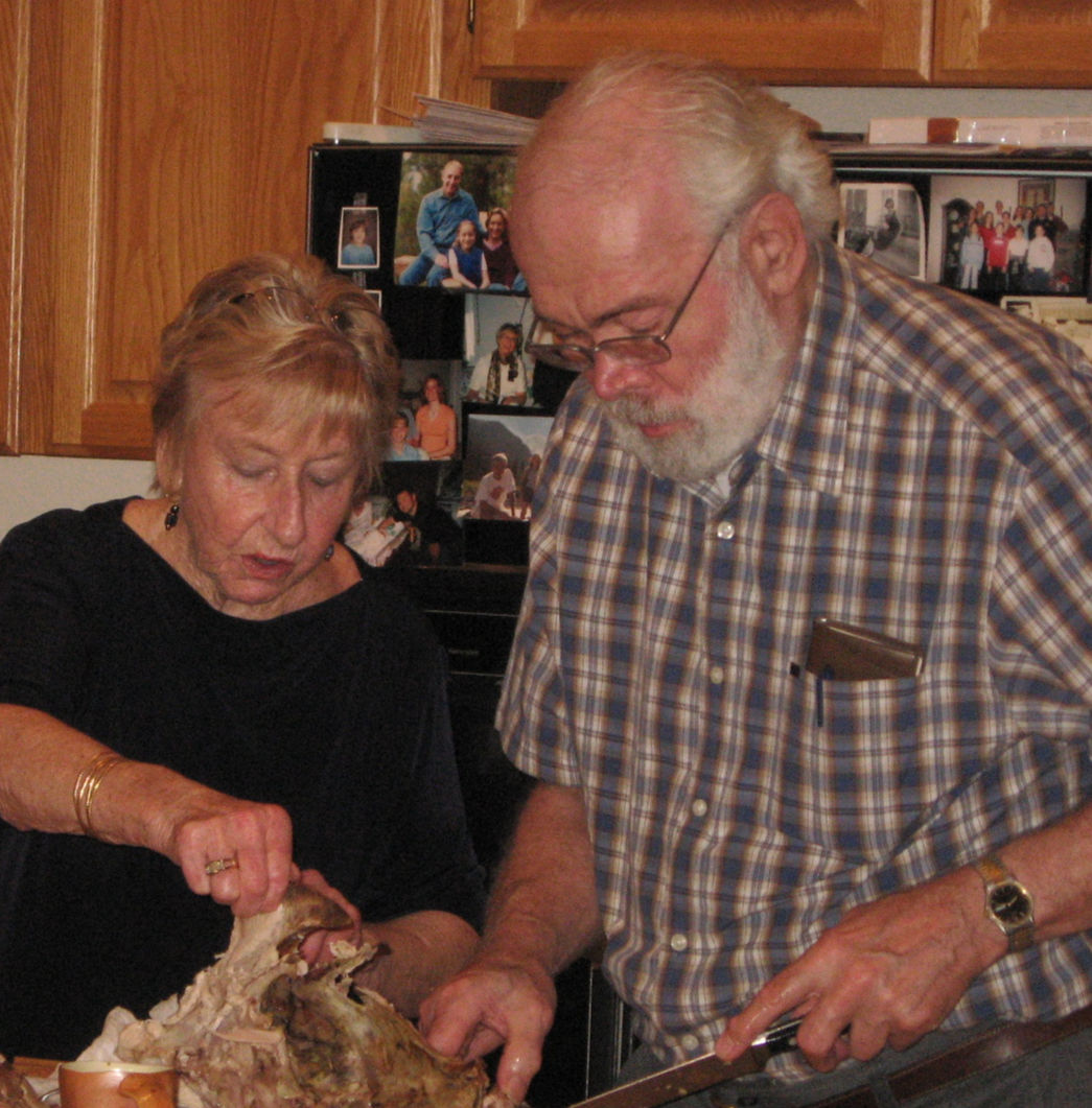 Life Lessons - Mom & my father in law cutting turkey