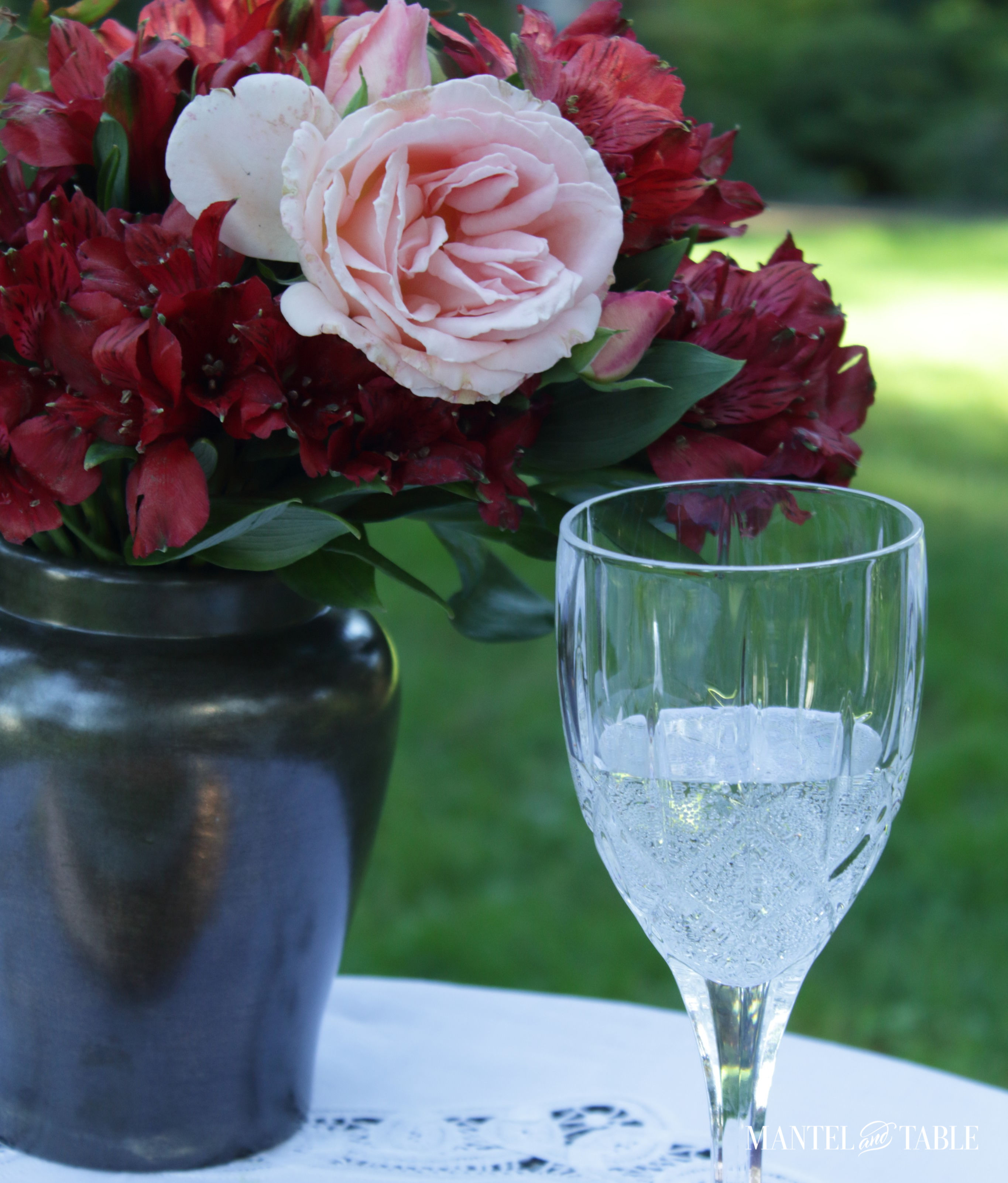 Elegant fall picnic flower arrangement and glass