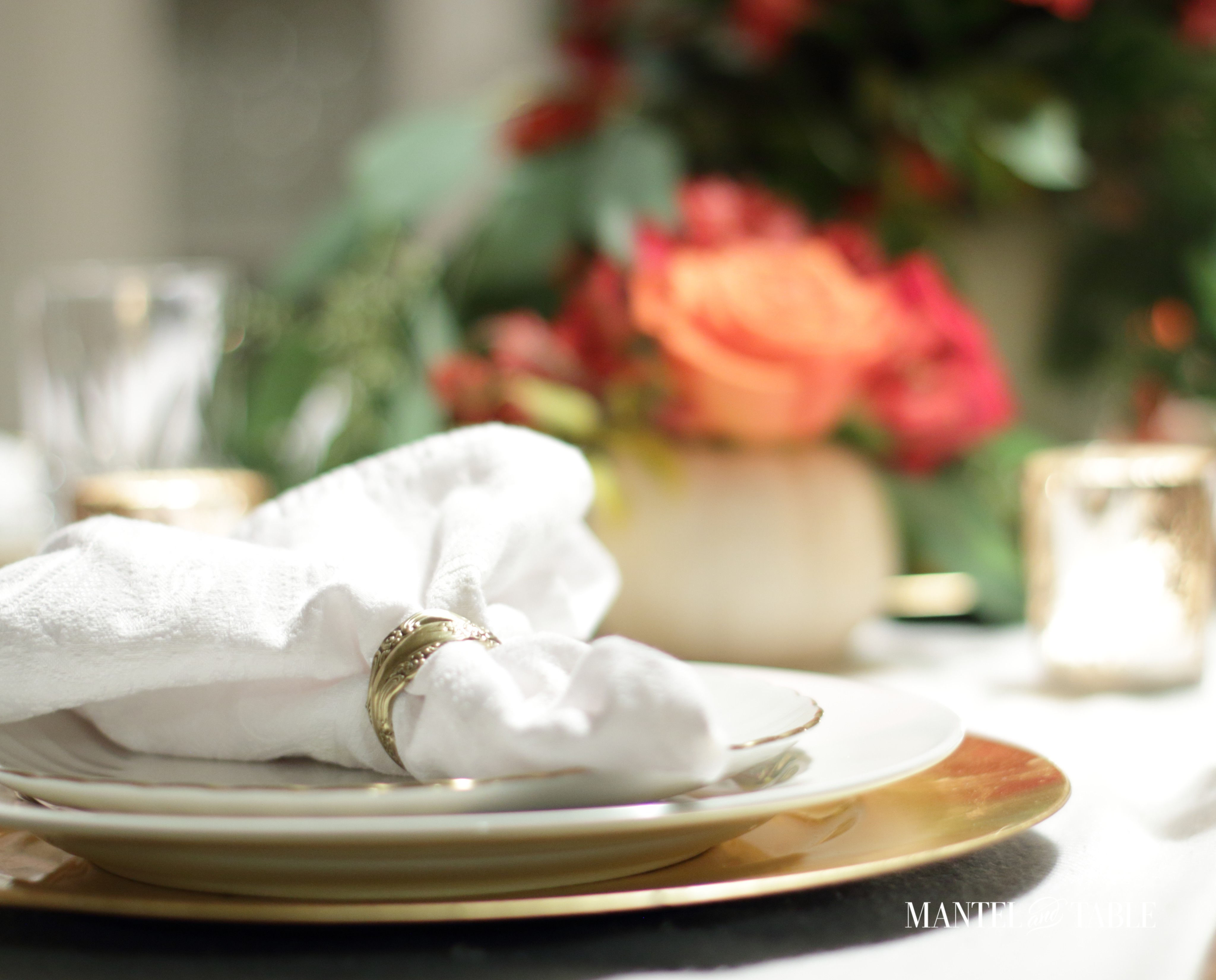 White pumpkin flower arrangement - gold napkin ring white napkin