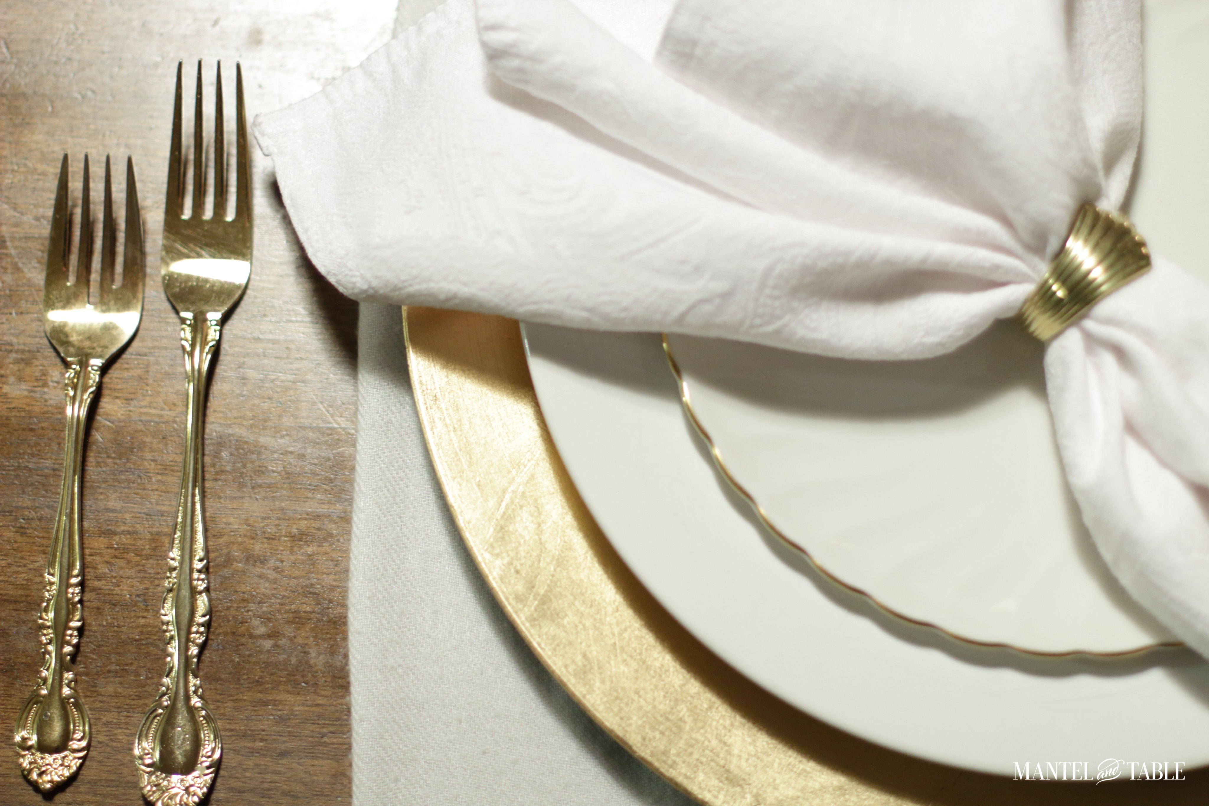 White pumpkin flower arrangement - white and gold plate stack & gold flatware