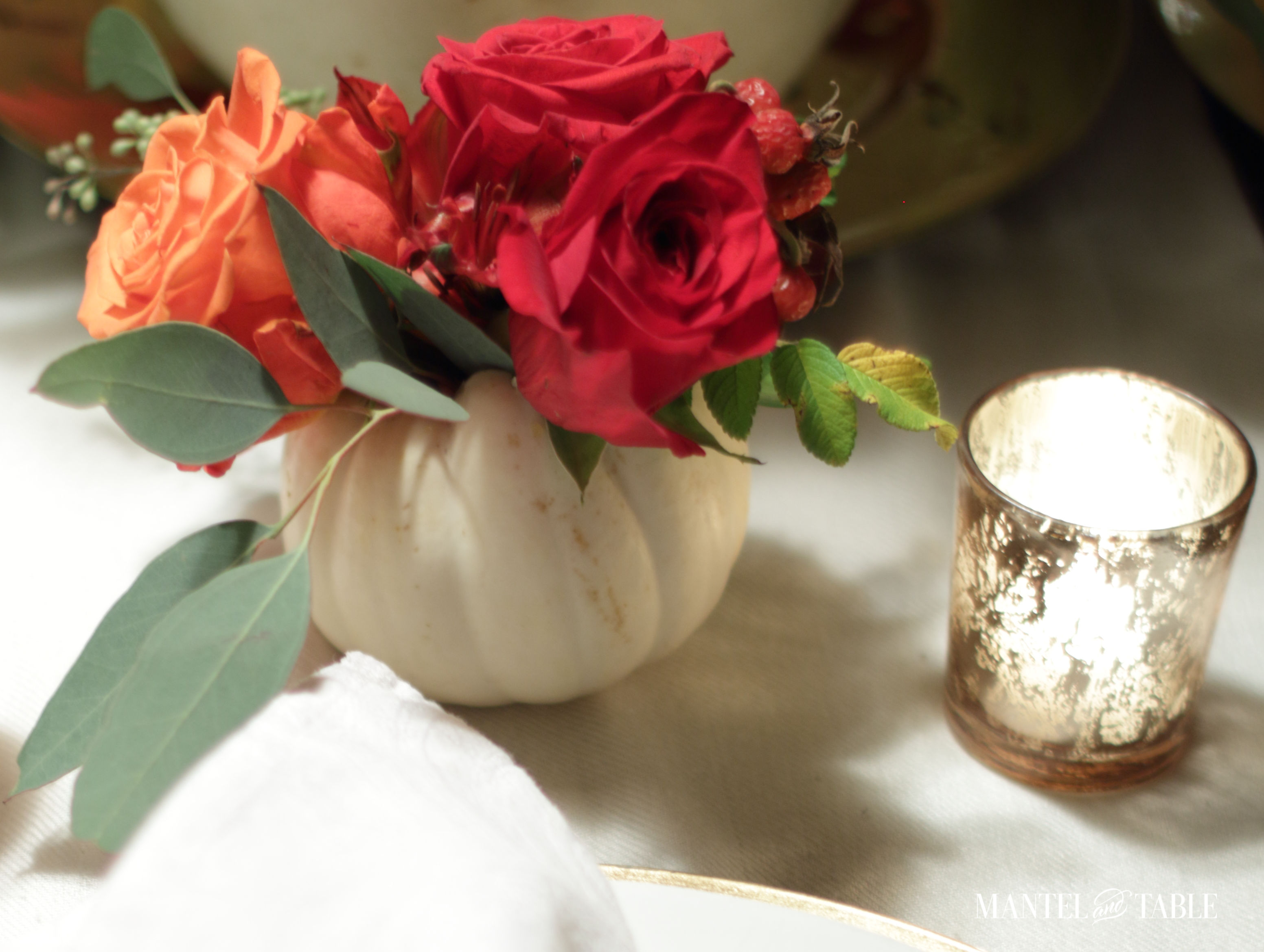 White pumpkin flower arrangement baby boo and candles